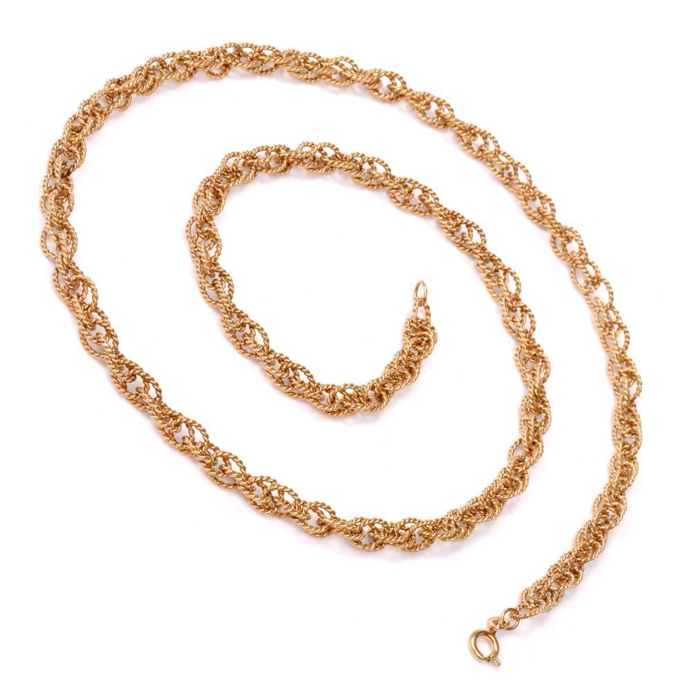 This vintage chain is handcrafted in solid 18K rich yellow gold, weighing approx. 58.5 grams and measuring 27