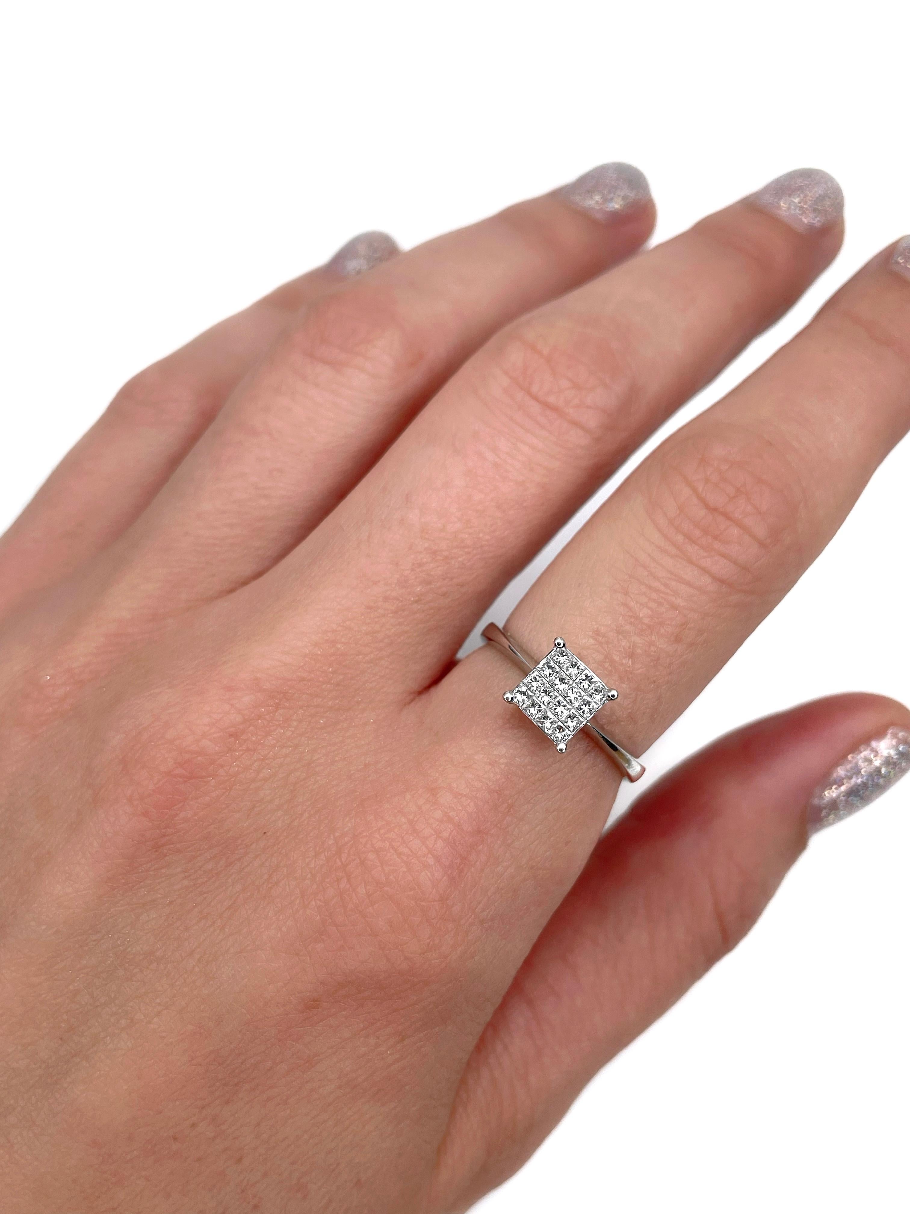 This is a vintage engagement ring crafted in 18K white gold. Circa 1980. 

The piece features 16 princess cut diamonds: TW 0.30ct, RW, VS (1-P1). 

Weight: 2.97g 
Size: 17 (US 6.5)

IMPORTANT: please ask about the possibility to resize before