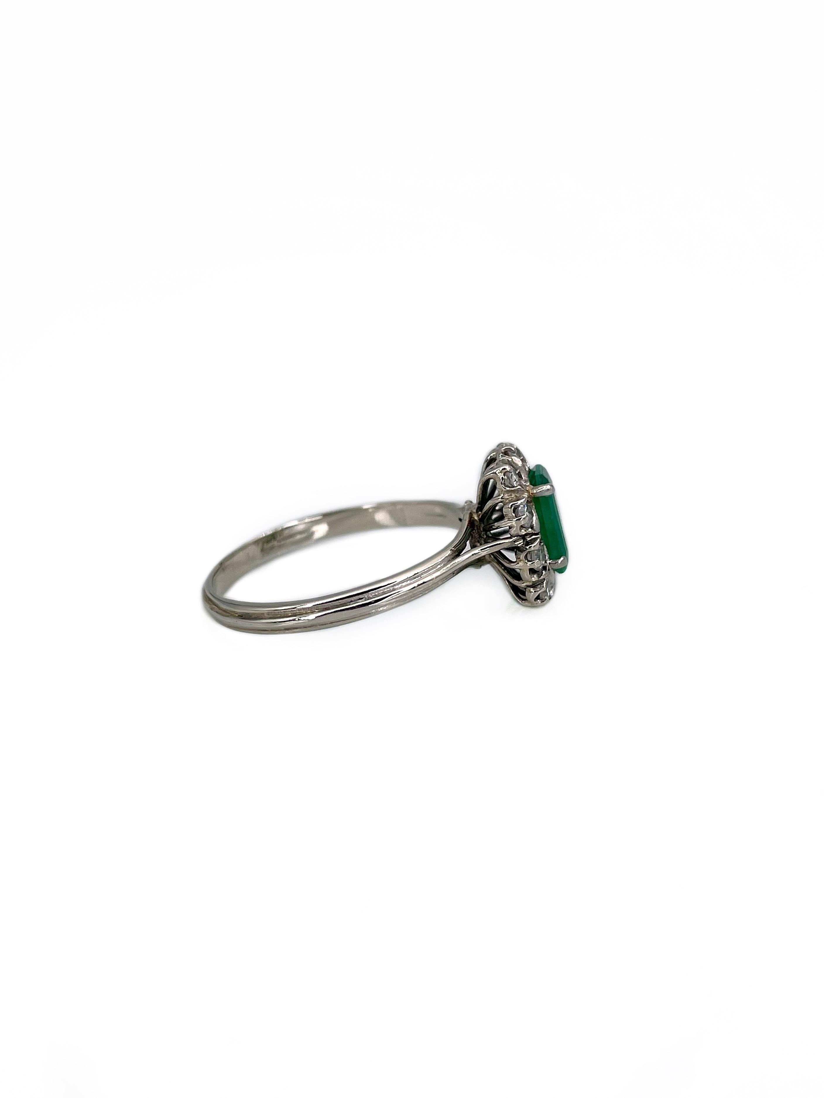 This is a lovely vintage rectangle cluster ring crafted in 18K white gold. Circa 1950. 
The piece features: 
- 1 rectangle emerald: 0.65ct, vslbG 6/4, P2
- 10 round (17 facet) diamonds: TW 0.20ct, RW+/W, VS-SI

Weight: 3.01g
Size: 18 (US