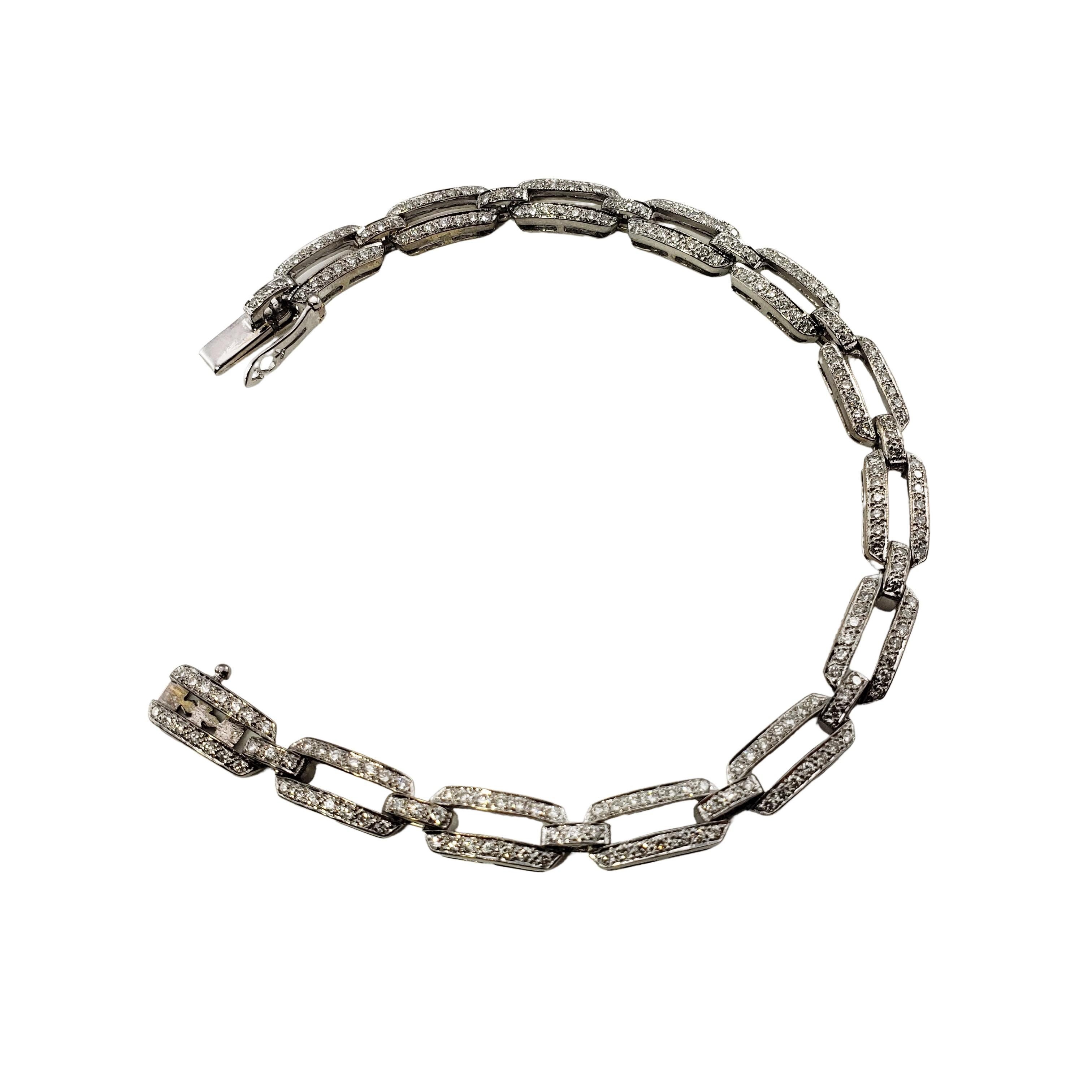 Vintage 18 Karat White Gold and Diamond Link Bracelet-

This sparkling bracelet features 221 round brilliant cut diamonds set in classic 18K white gold.  Width:  5 mm.

Approximate total diamond weight:  1.10 ct.

Diamond color: I-J

Diamond