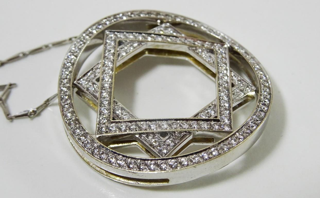 
A unique Mid Century Pendant.
The shape of a square on a square is a arabesque shape know as  Rub-el-Hizb.
I think that the design was not made in that context but that is what it is ,
The pendant is set with over 2 carats of VVS - H Diamonds.
It