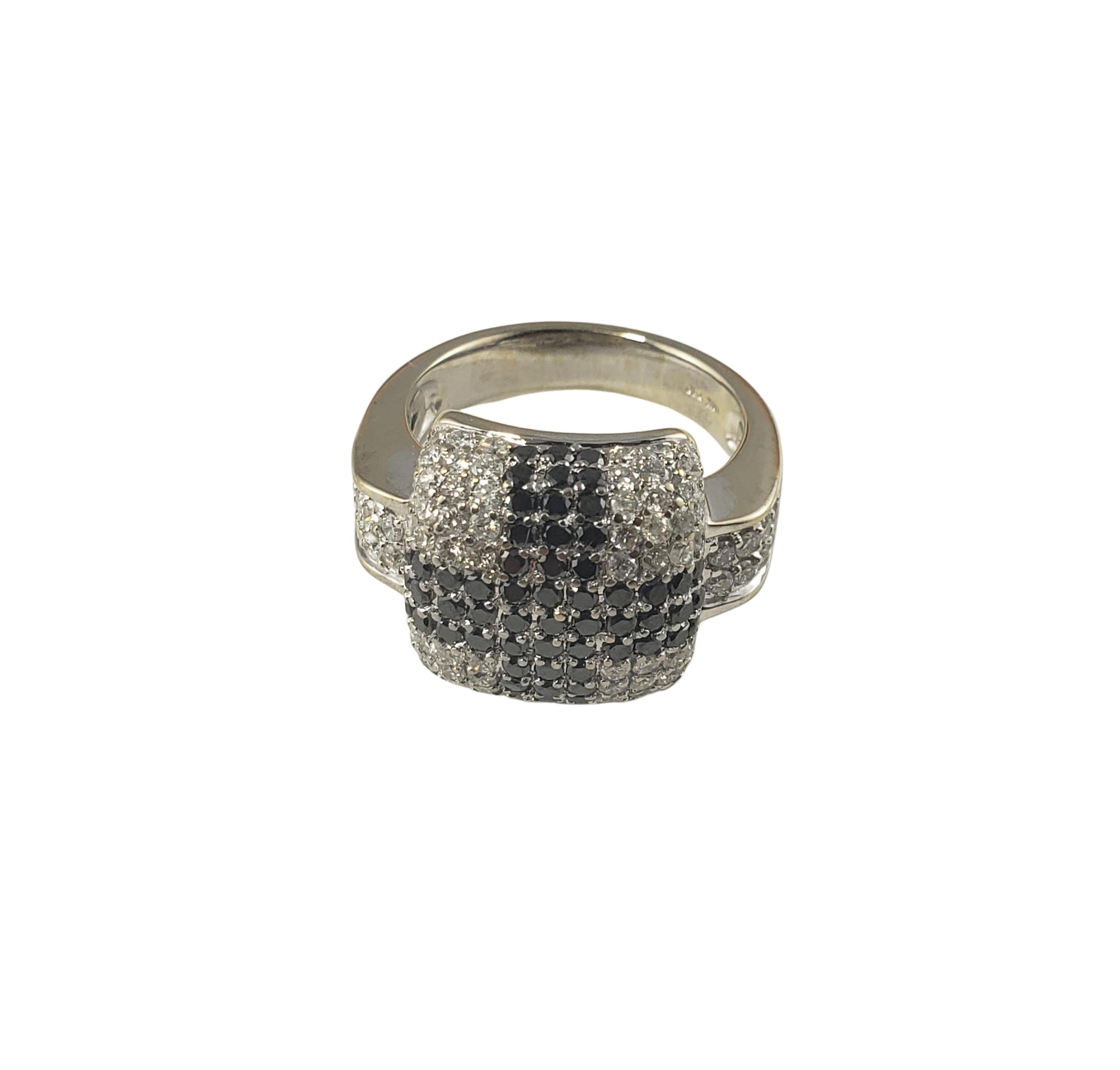 Vintage 18 Karat White Gold Black and White Diamond Ring Size 6.75-

This sparkling ring features white and black round brilliant cut diamonds set in beautifully detailed 14K white gold  Width: 14 mm.
Shank: 4 mm.

Approximate total diamond weight: