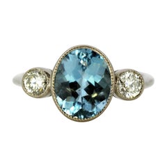 Vintage 18 Karat White Gold Ladies Three-Stone Ring with Aquamarine and Diamonds