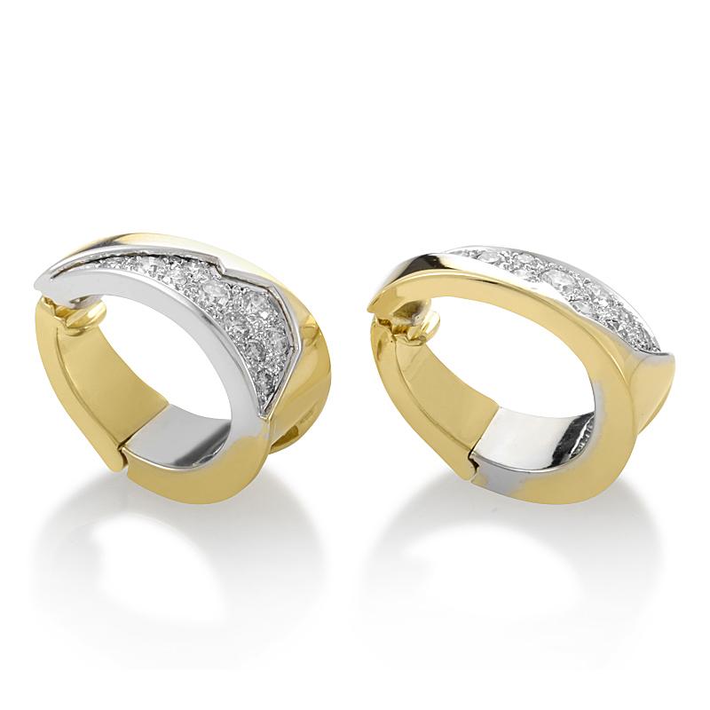 This gorgeous pair of vintage earrings are elegant and refined. The earrings are made of 18K yellow gold and are accented with diamond-set white gold.

