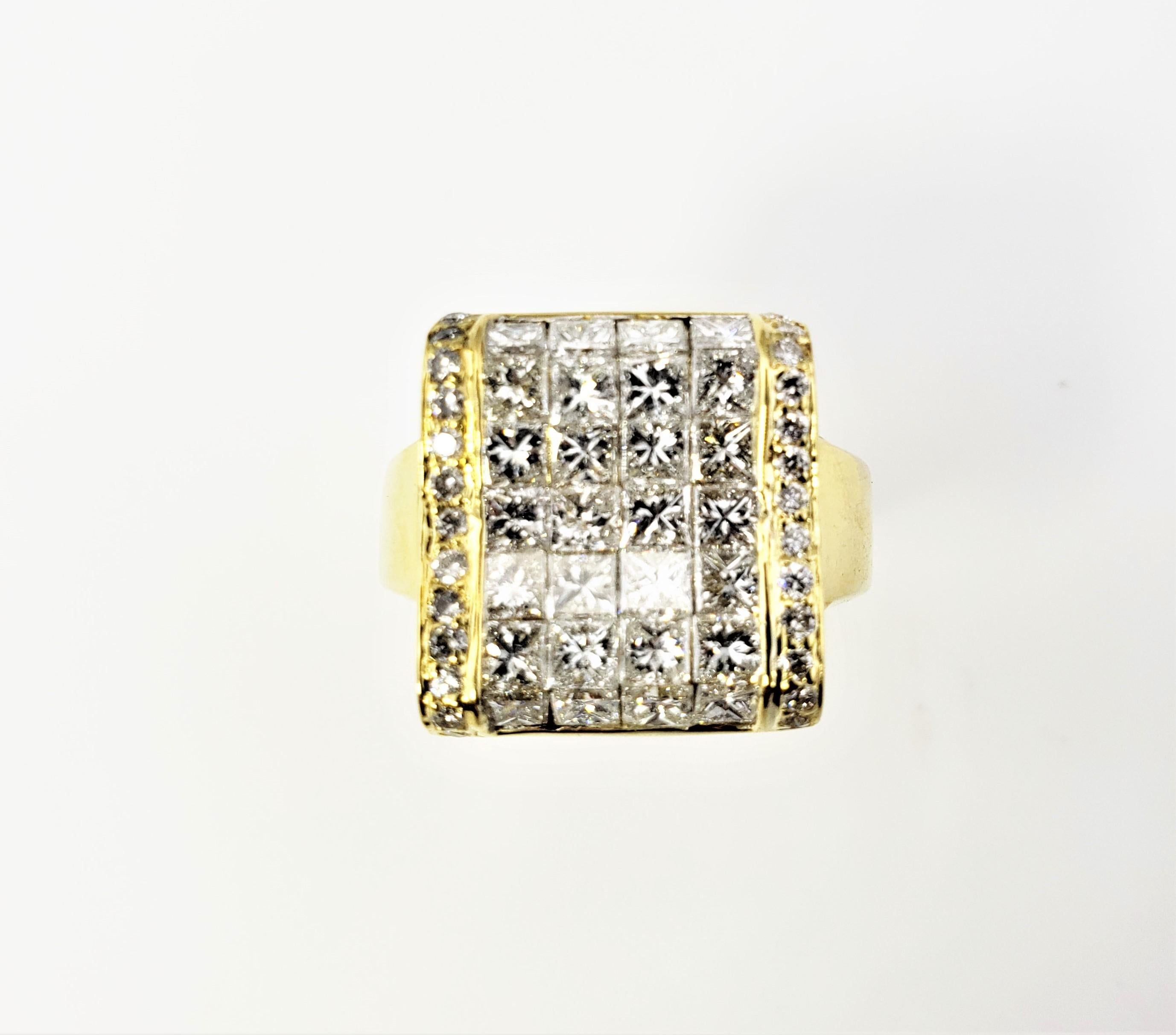 Vintage 18 Karat Yellow Gold and Diamond Ring Size 5.25 GAI Certified-

This sparkling ring features 26 round brilliant cut diamonds and 28 princess cut diamonds set in elegant 18K yellow gold.  Top of ring measures 17 mm x 15 mm.  Shank measures 4