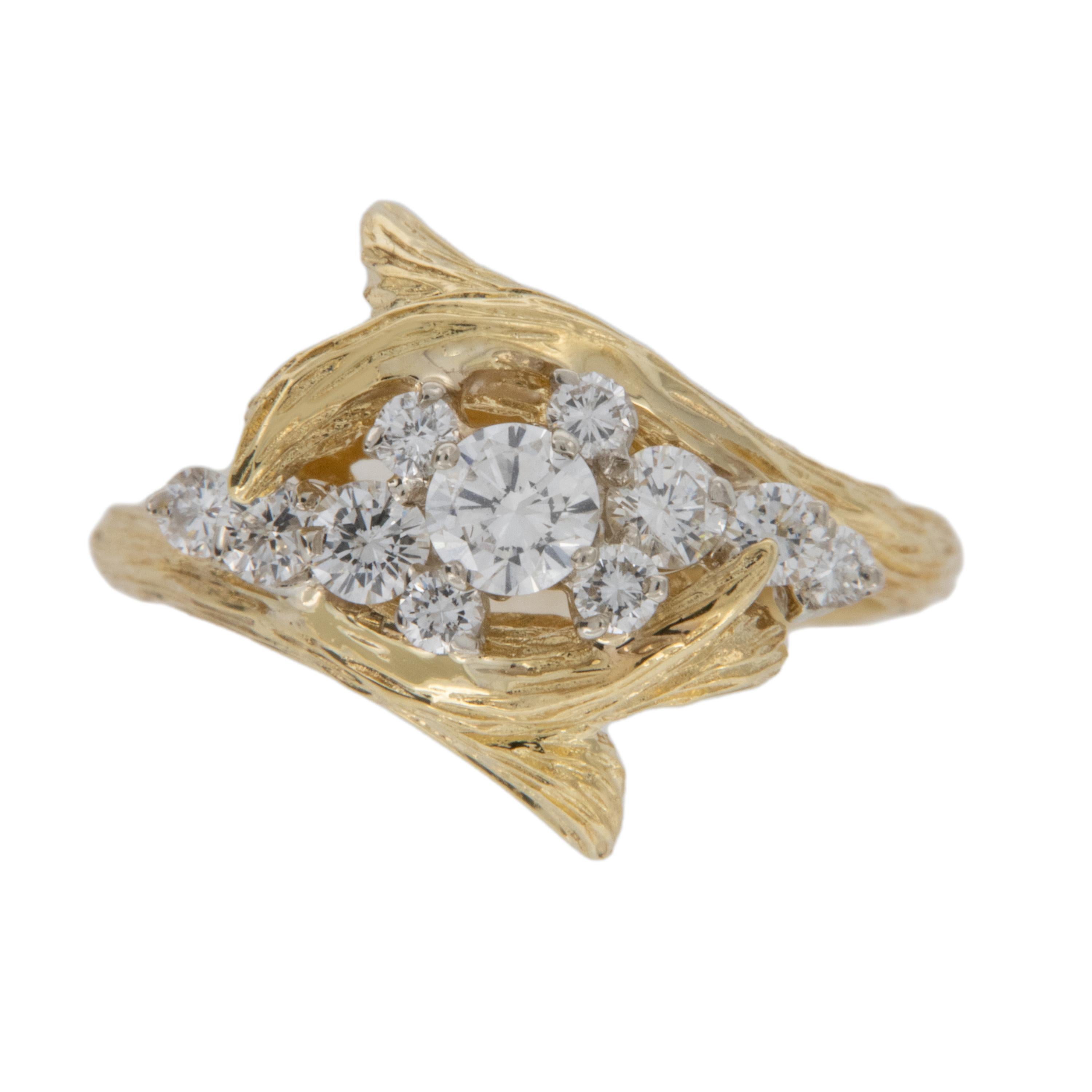 Unique and graceful, this vintage slight bypass ring in rich 18 karat yellow gold is set off with bark like finish on the elegant branches that showcase the fine VS clarity, F - G color diamonds = 0.75 Cttw. Ring is a size 7, but can be sized.