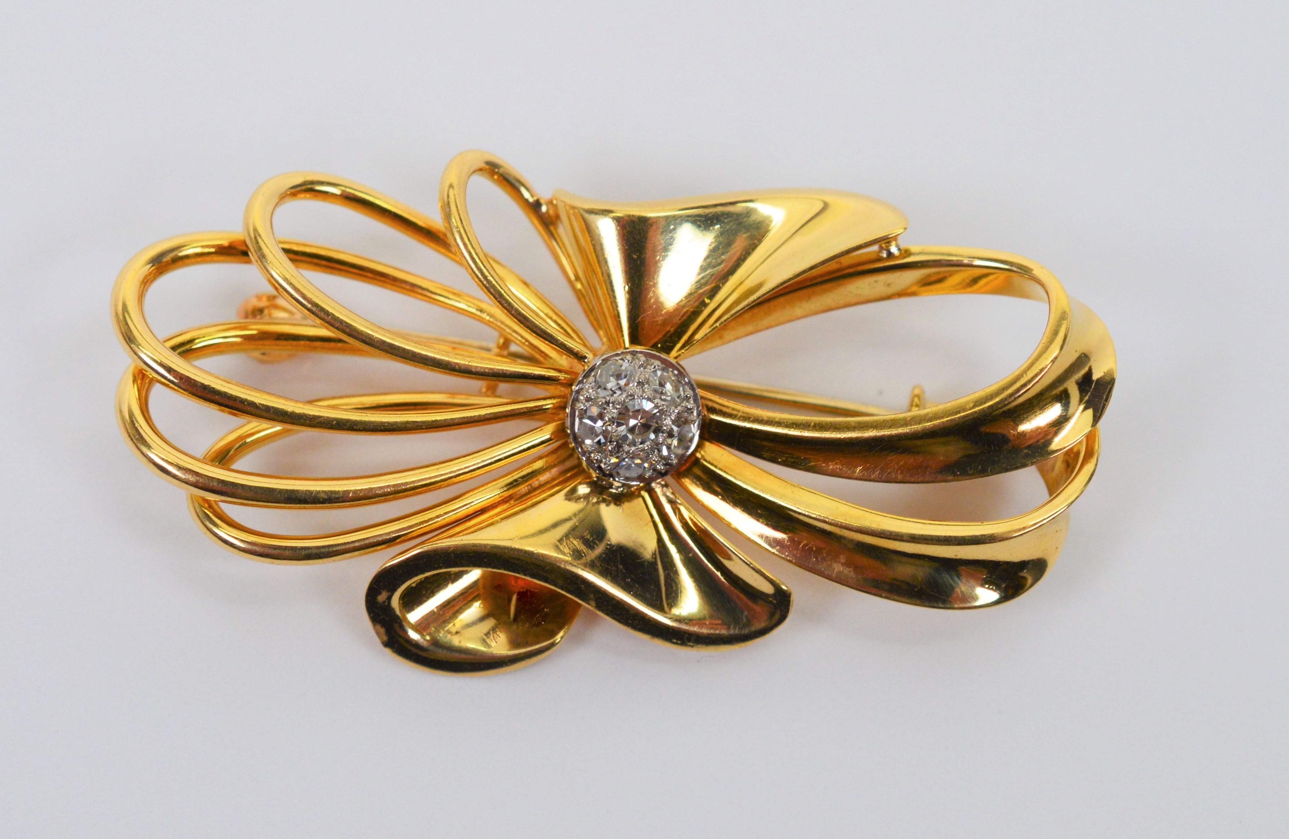 Add a bit of flair to a jacket lapel or blouse with this darling vintage gold diamond bowtie brooch. Stylish swirls of eighteen karat 18K yellow gold create a whimsical bow synched at the center and is accented with six .05 carat round H/SI 