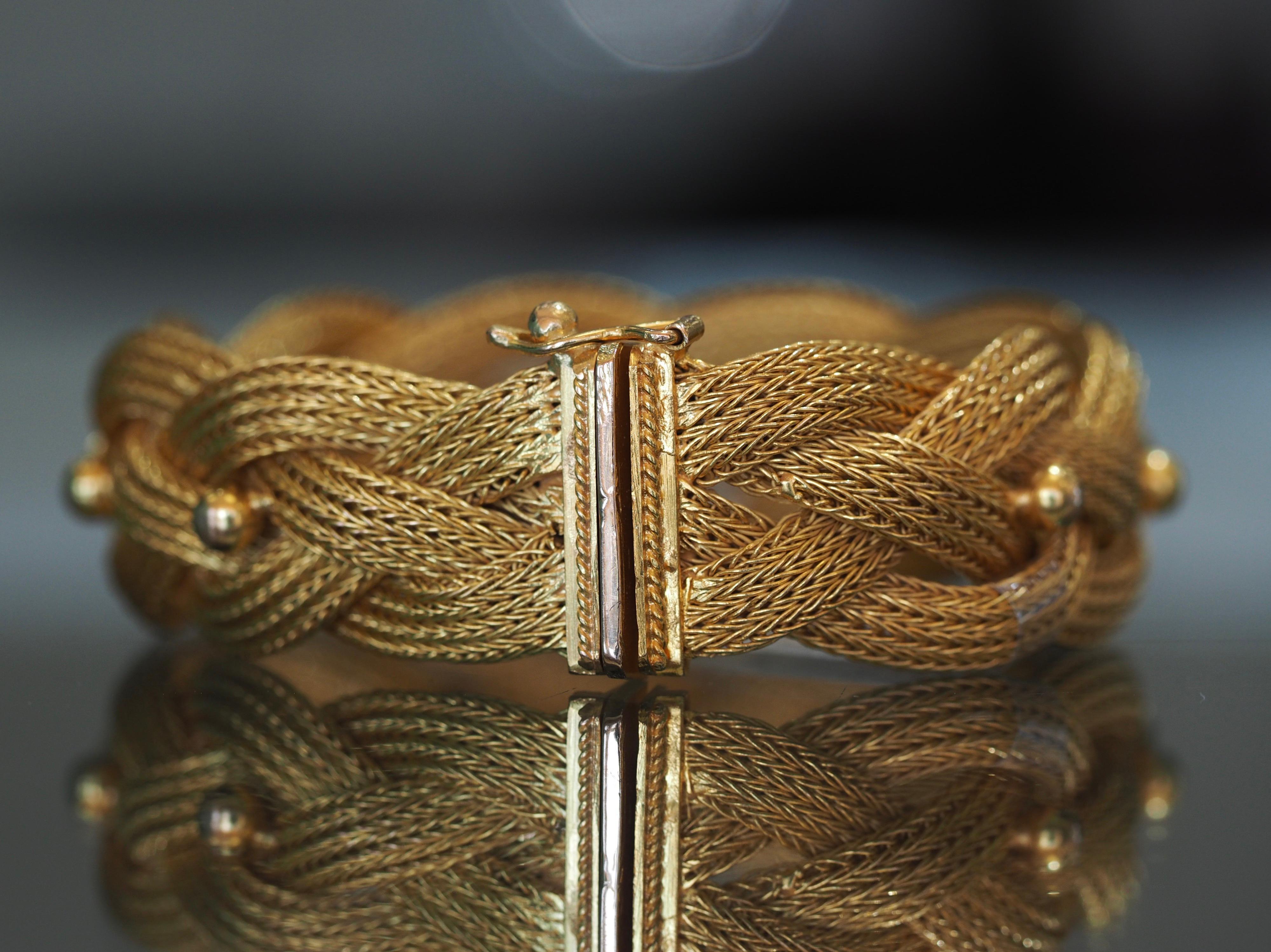 This vintage braided mesh  bracelet is sure to you make feel like a golden goddess. It’s made perfectly to lay flat on the wrist. There are nine (9) individual gold beads throughout the bracelet that are connected between the woven strands. It is 18