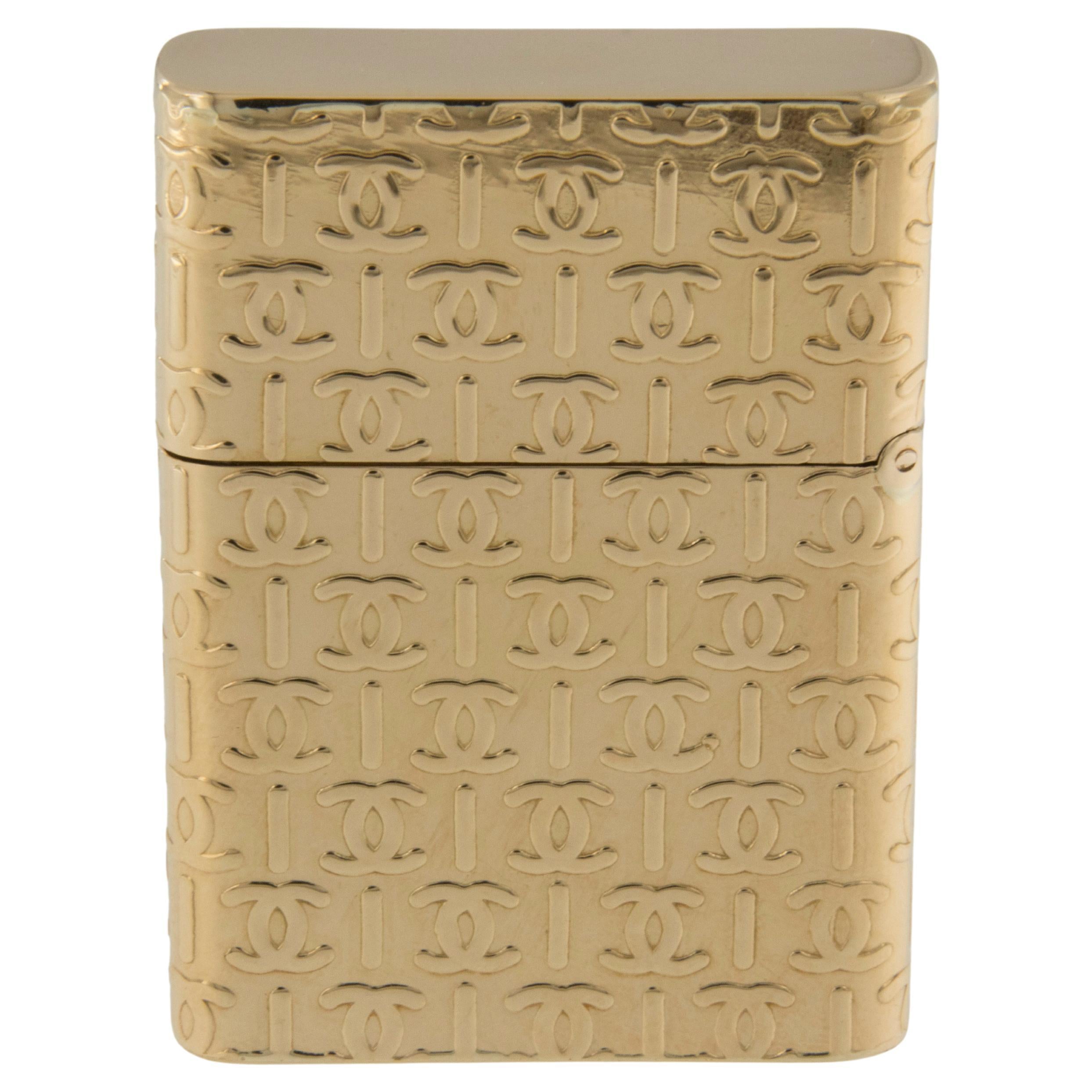 Handsome never used 18 karat yellow gold Cartier cigar lighter for the ever stylish gentleman. Iconic double CC design and in perfect working order. Complimentary signature wrapping and presentation box included. Over an ounce of 18 karat gold!