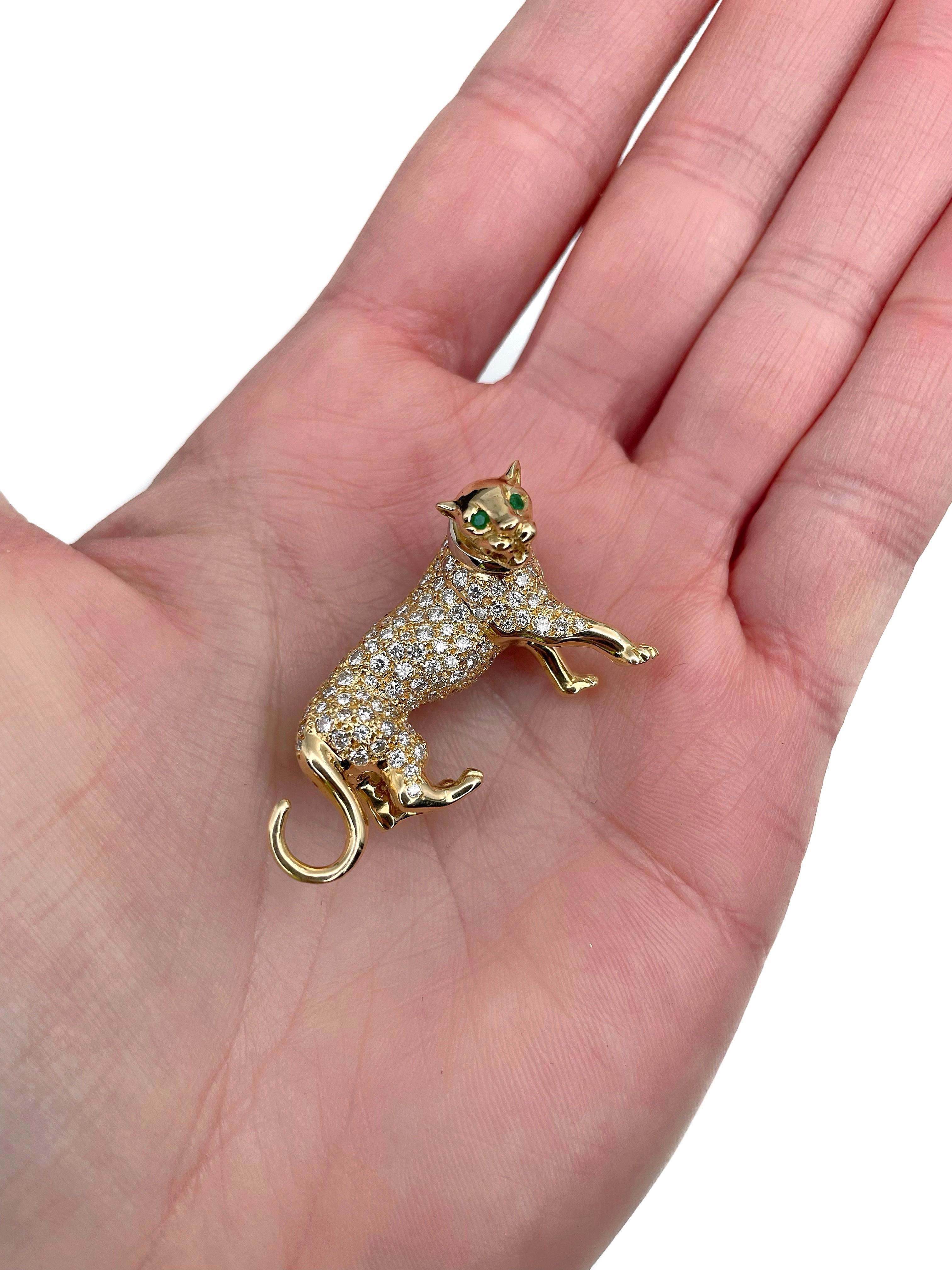 This is an amazing panther pin brooch crafted in 18K yellow gold. Circa 1980. 

The piece features:
- 2 emeralds (round cut, TW 0.03ct, vslbG 5/5, SI) 
- 113 diamonds (round brilliant cut, TW 1.60ct, RW+/RW, VS-SI)

Has a safe clasp. 

Weight: