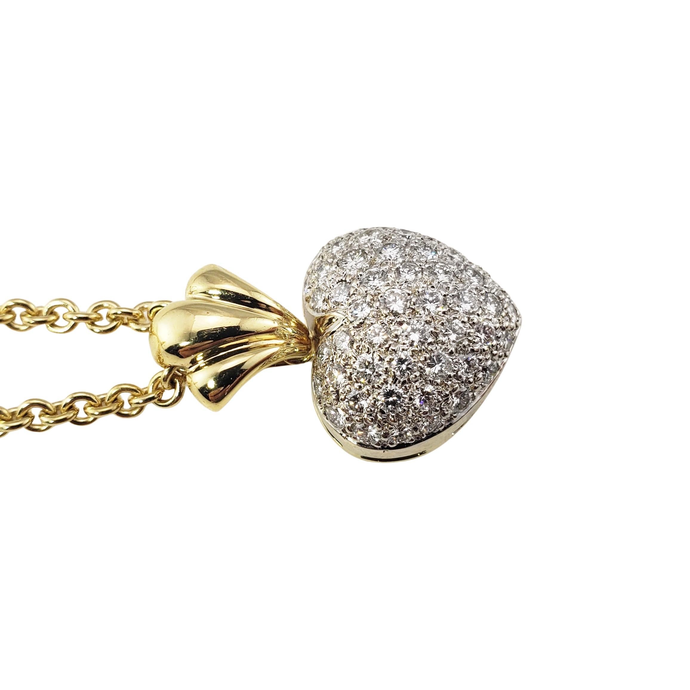 Vintage 18 Karat Yellow Gold Diamond Heart Pendant Necklace-

This sparkling heart pendant features 49 round brilliant cut diamonds set in beautifully detailed 18K yellow gold and suspends from a 16 inch cable necklace. 

Approximate total diamond