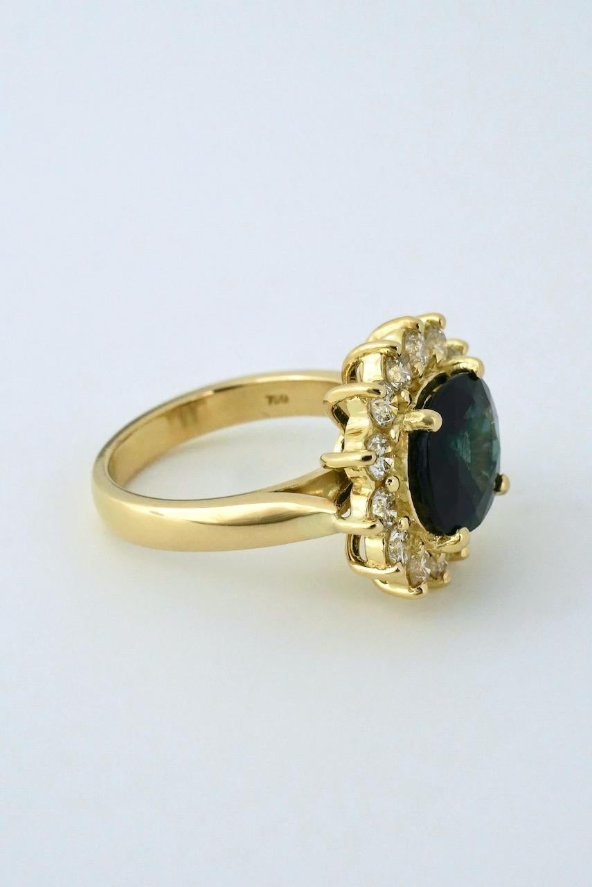 Contemporary Vintage 18 Karat Yellow Gold Diamond Sapphire Cluster Ring For Sale