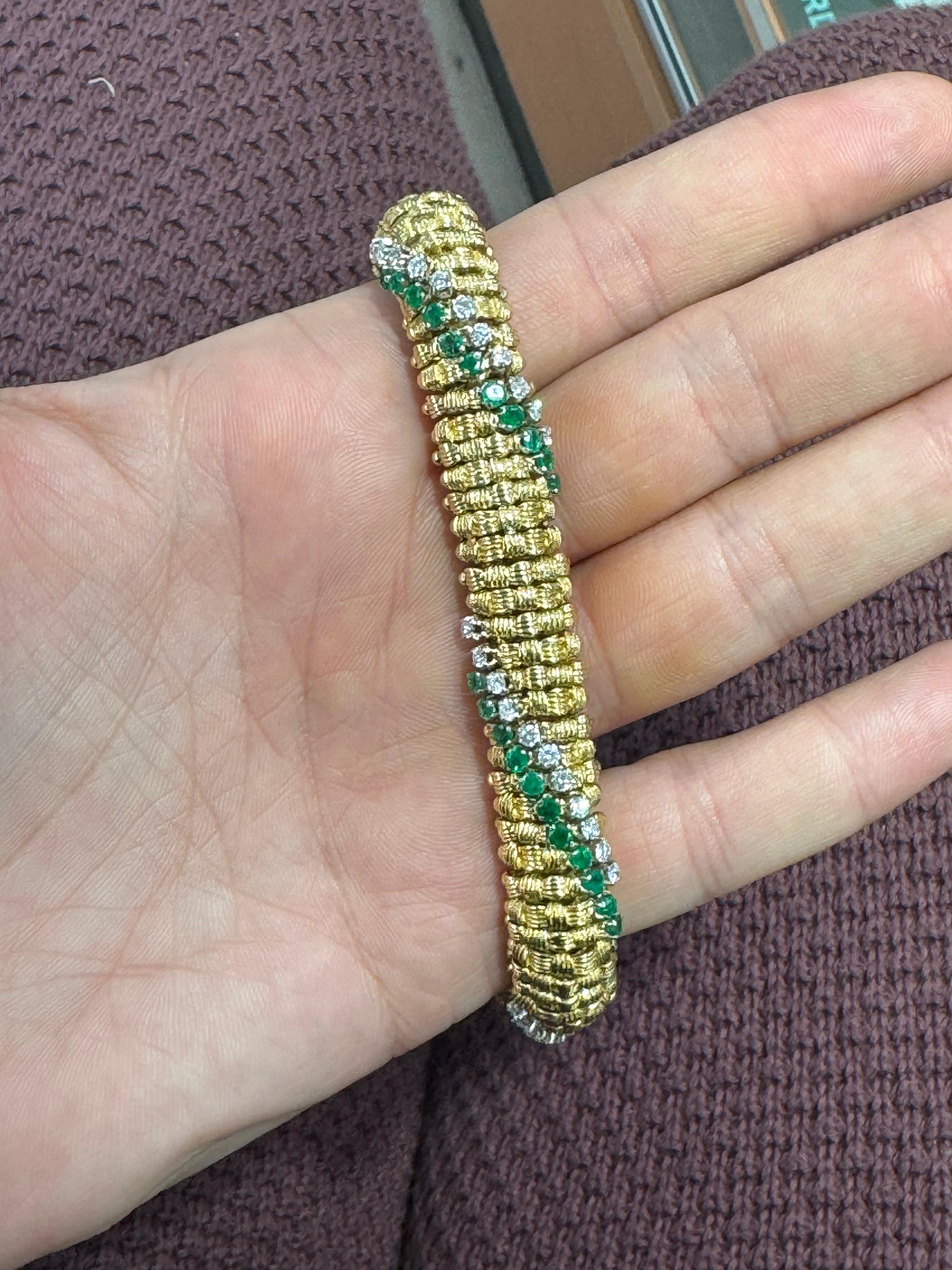 18 Karat yellow gold woven motif bracelet featuring four sections of Emerald and Round Brilliants, 61.1 grams, 7 inches.