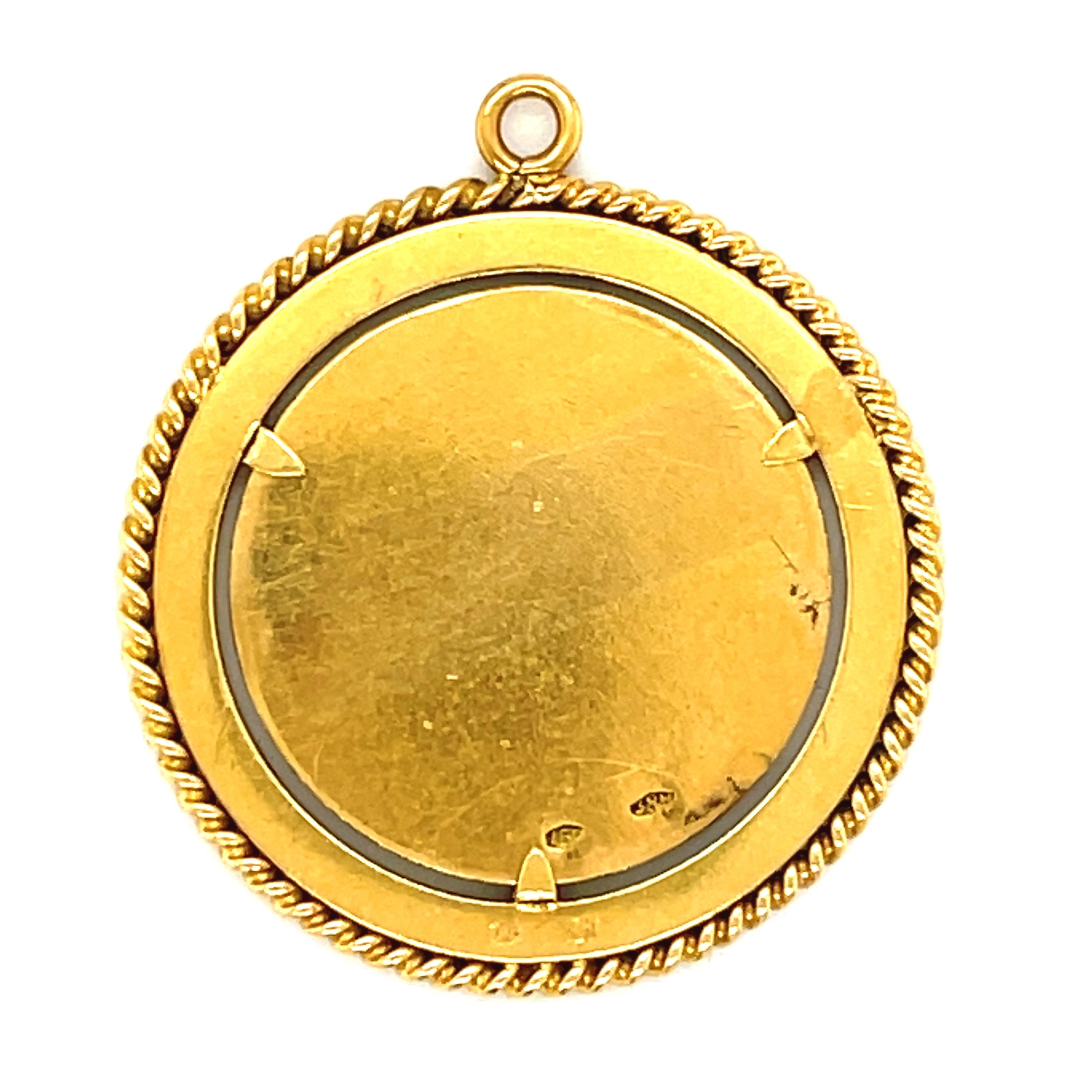 A collectible 18k yellow gold enamel Gemini zodiac charm with enamel circa 1970. This charm is particularly unusual because the charms of similar manufacture are usually the size of dimes while this one is more the size of a quarter. The typical