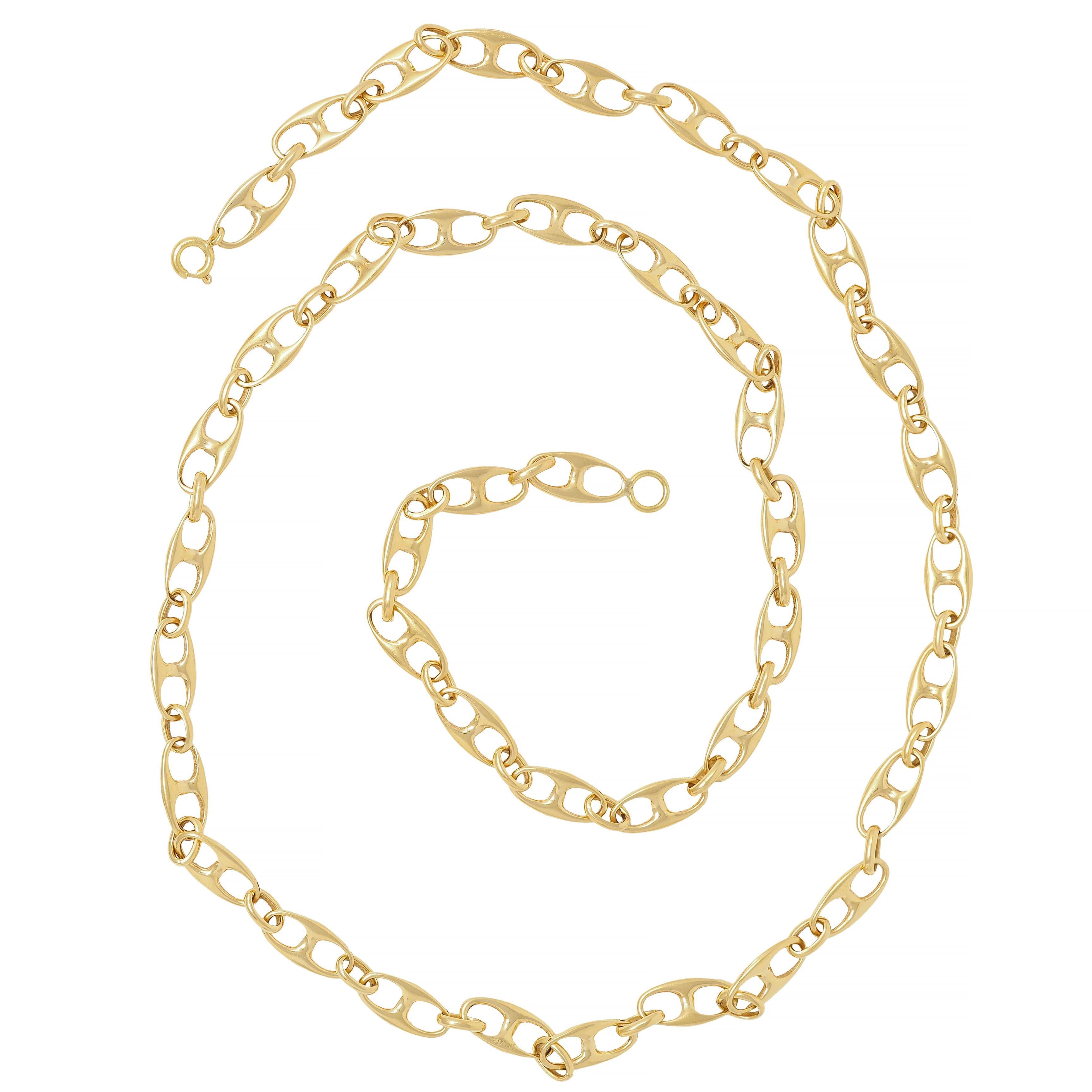 Comprised of puffy mariner links and oval links alternating in pattern
With high polish finish 
Completed by spring clasp closure
Stamped for 18 karat gold
Circa: 1960s
Width at widest: 1/4 inch 
Total length: 24 5/8 inches
Total weight: 25.4 grams