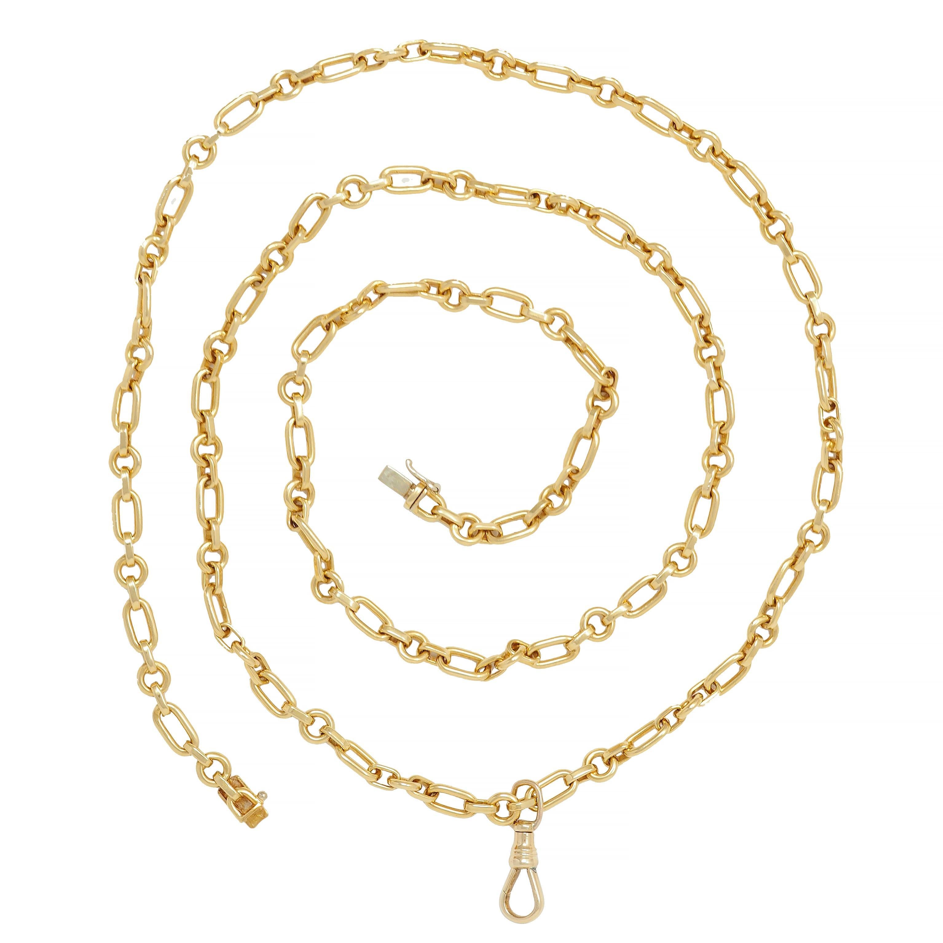 Designed as a stylized paperclip-style chain with alternating round and oval links 
Connected via flat bar links and suspending an antique-style fob bale 
Competed by a concealed clasp closure
With figure eight safety 
Chain is stamped with Italian