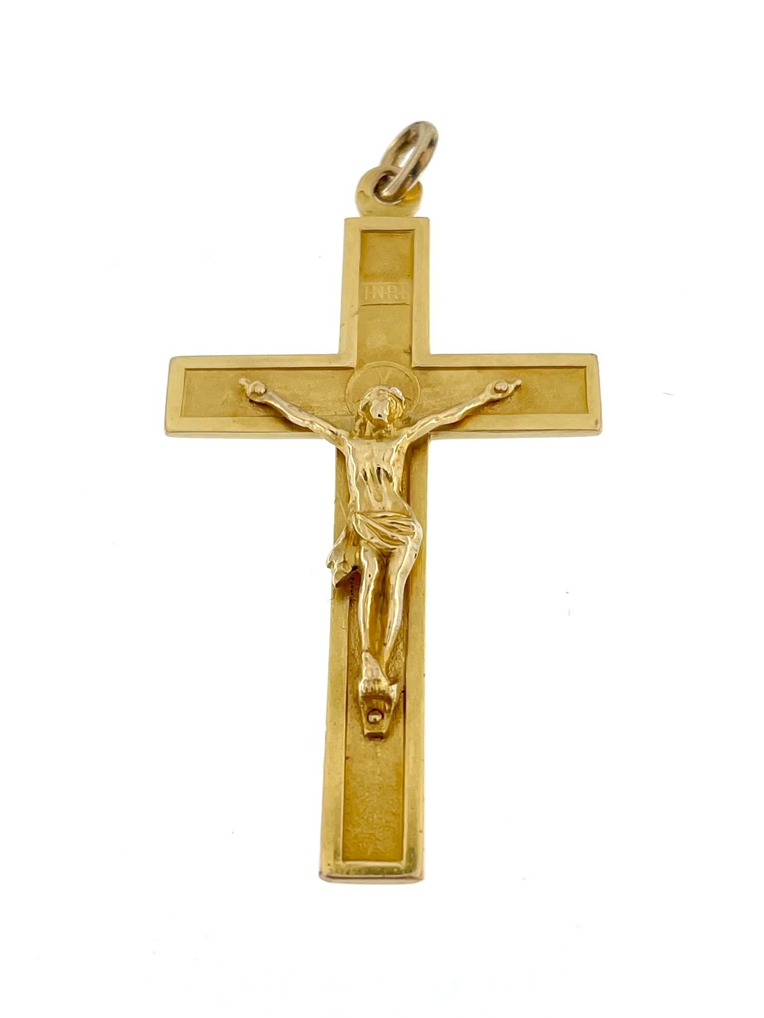The Vintage 18-karat Yellow Gold French Crucifix is a timeless and elegant piece of religious jewelry with a touch of French craftsmanship. 

Crafted from 18-karat yellow gold, this crucifix embodies a classic and enduring beauty. The use of