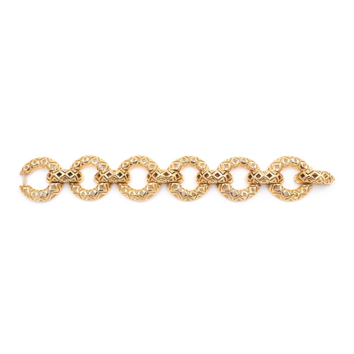 A unique & Heavy Vintage Tiffany & Co. Geometric Cutout Bracelet., composed of 18k yellow gold. The links have geometric cut out details, alternating between large circular links and horizontal connecting links. The bracelet measures approximately
