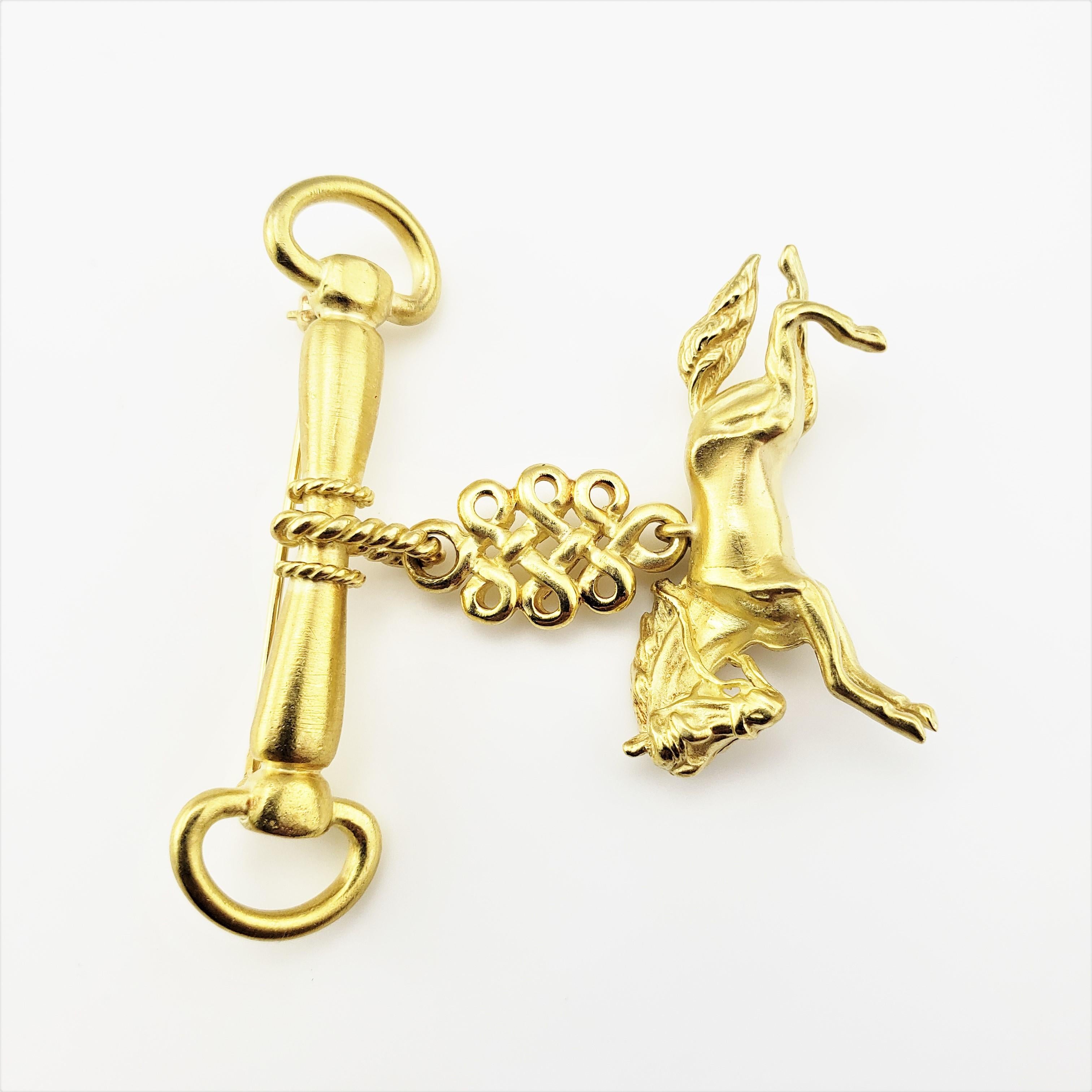 Vintage 18 Karat Yellow Gold Horse Brooch/Pin-

This spectacular brooch features a proud stallion in motion (19 mm x 35 mm) suspended from a beautifully crafted horse bit bar pin. Beautifully detailed in 18K yellow gold.

Size: 50 mm x 43