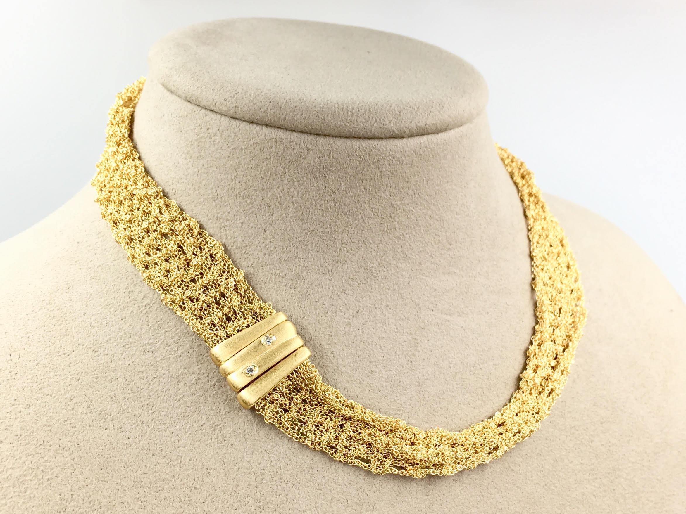 All 18 karat yellow gold mesh necklace designed by Gori and Zucchi. Expertly woven gold chains lay beautifully on the collar of the neck at a 16