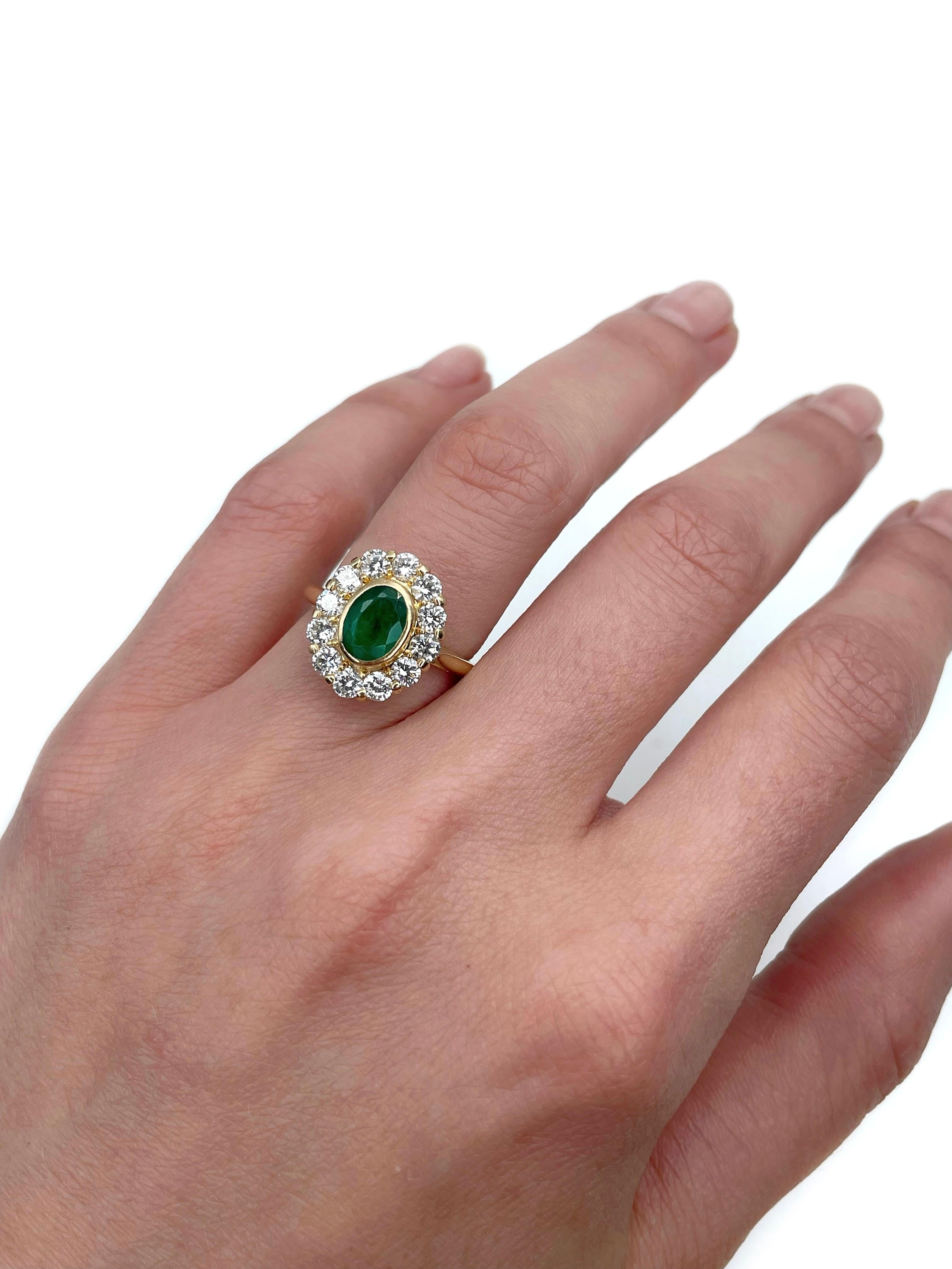 This is a vintage cluster ring crafted in 18K yellow gold. Circa 1970. 

The piece features:
- 1 emerald (oval cut, 0.80ct, vslbG 6/4, P2)
- 12 diamonds (round brilliant cut , TW 1.10ct, RW-W, VS)

Weight: 4.05g
Size: 16.25 (US 5.5)

IMPORTANT:
