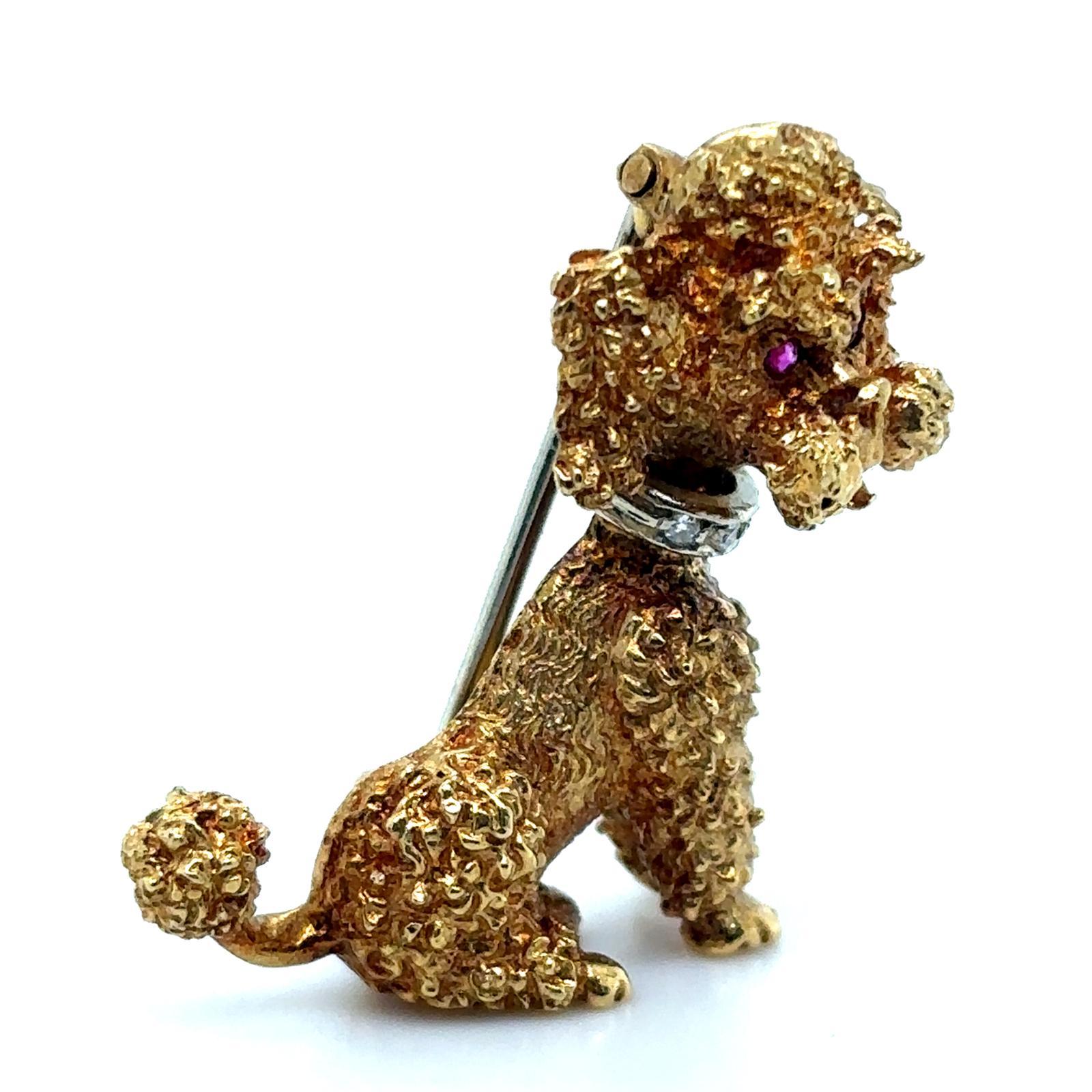 A vintage 18 karat yellow gold diamond and ruby poodle brooch pin, circa 1960

This charming vintage poodle dog pin brooch is beautifully made. The strands of his fur on his body, face and tail are highly detailed with contrasting plain polished