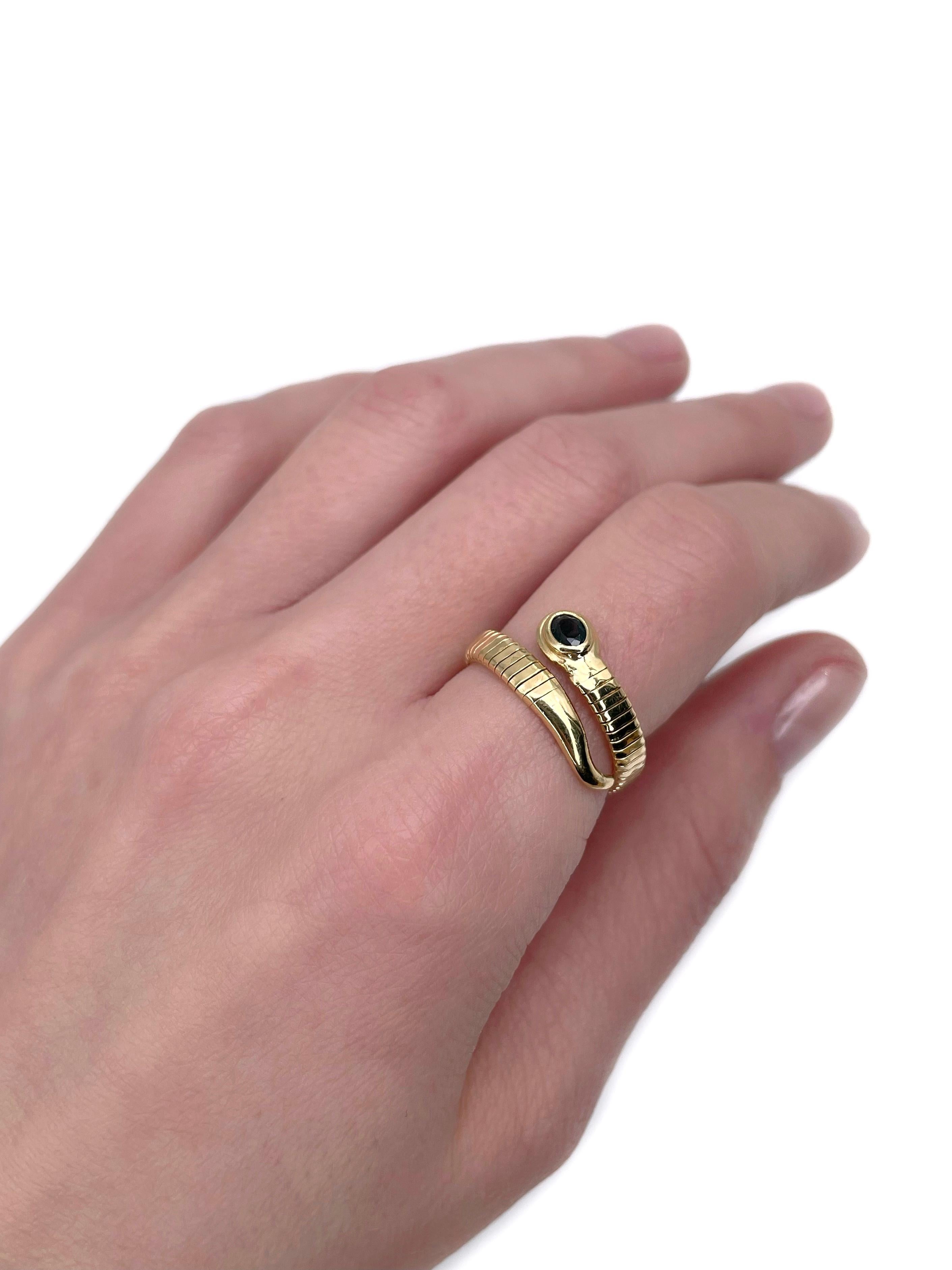 This is a vintage flexible snake ring crafted in 18K yellow gold. Circa 1980. 

The piece features oval cut blue sapphire.

Weight: 4.60g
Size: ~17.75 (US ~7.5)

———

If you have any questions, please feel free to ask. We describe our items