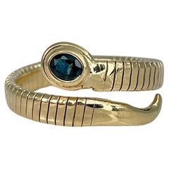 Anillo de serpiente flexible vintage de oro amarillo de 18 quilates con zafiro