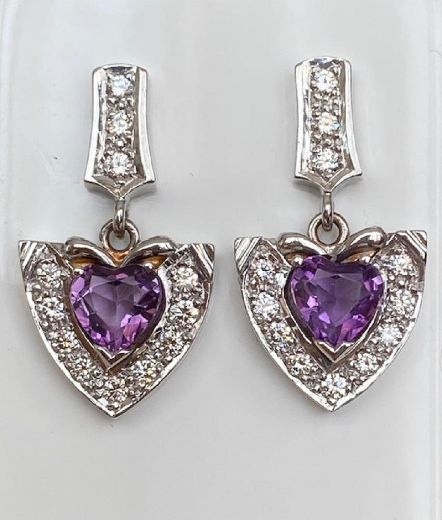 Offered in good condition, white gold 18 KT heart earrings set with 2 pieces of heart cut amethyst in total approx. 2.00 ct and 24 pieces of brilliant cut diamonds in total estimated at approx. 0,80 ct of quality H/VS.
Natural amethyst: approx. 2.00