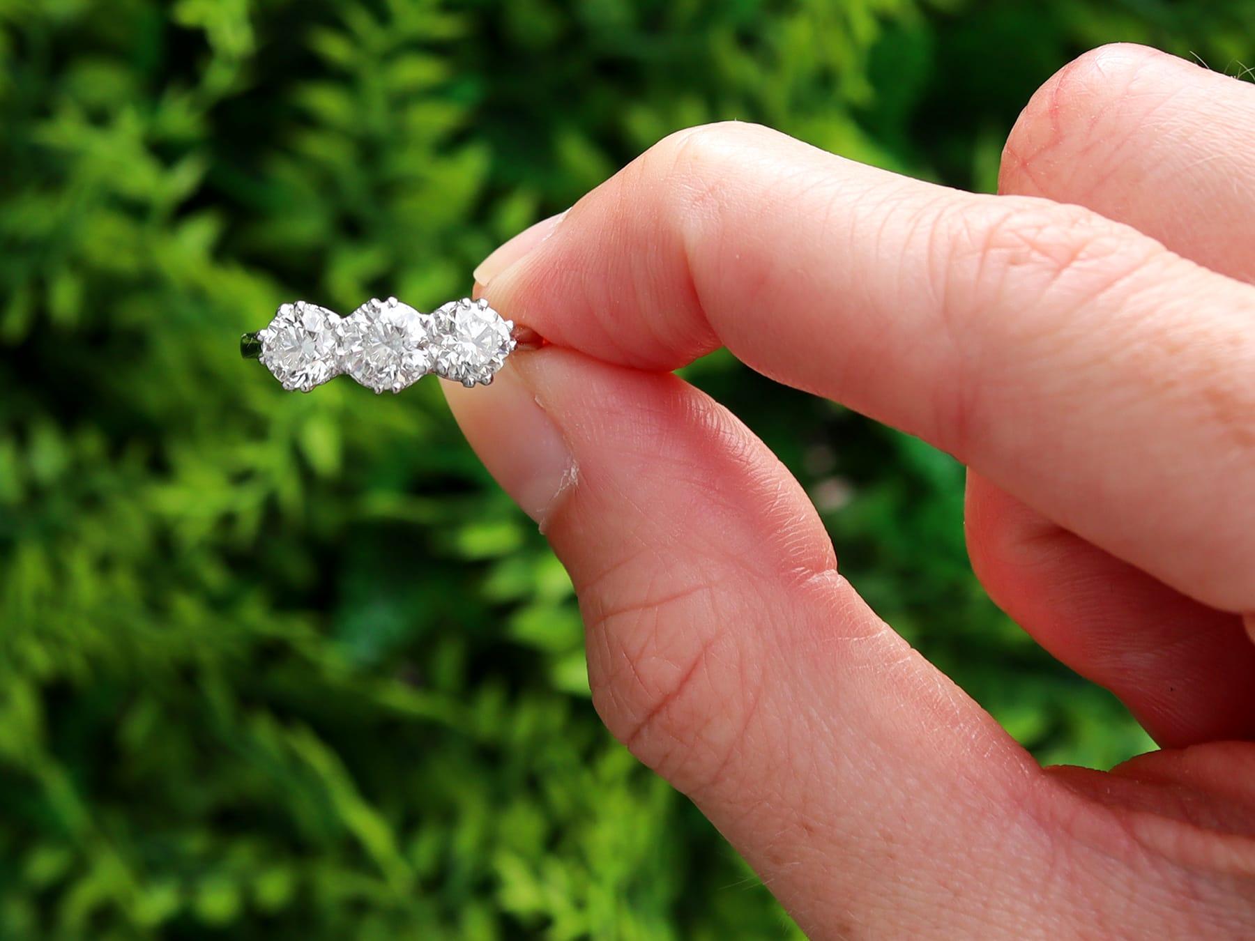 A stunning, fine and impressive vintage 1.81 carat diamond and platinum trilogy ring; part of our diverse vintage engagement rings collection.

This stunning, fine and impressive vintage trilogy ring has been crafted in platinum.

The pierced