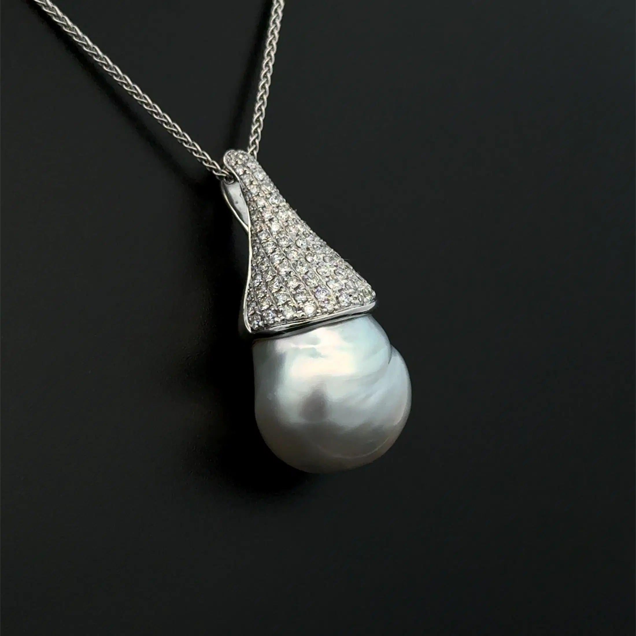 Simply Beautiful! Large Baroque Pearl and Diamond Gold Vintage Pendant Necklace. Featuring an 18.25mm Baroque Pearl and Hand crafted 18K White Gold Pendant, Hand set with Brilliant Cut Diamonds, weighing approx. 1.20tcw. Suspended from an 18” White