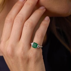 Vintage 1.84 carat emerald diamond platinum three stone ring