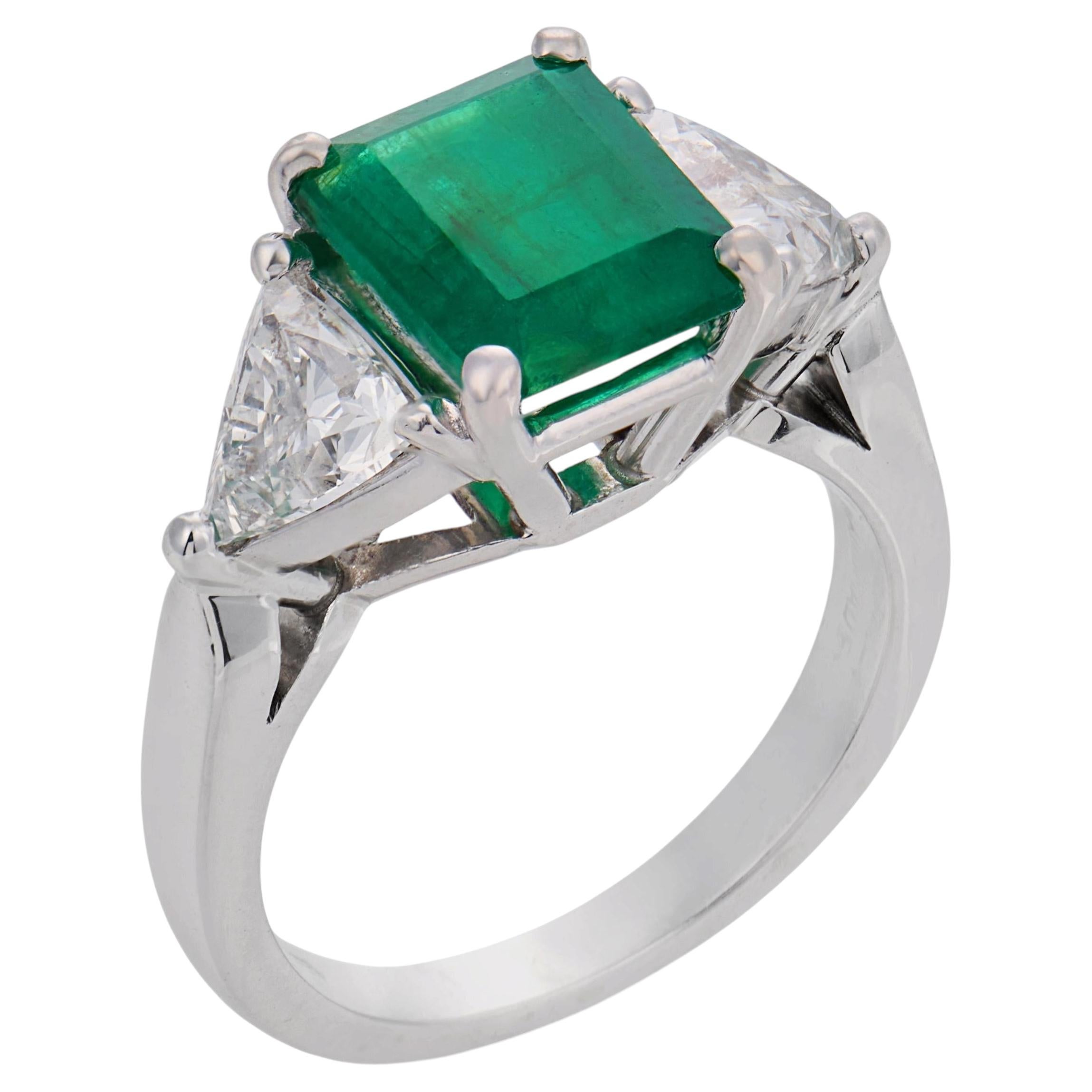 Vintage 1.84 carat emerald diamond platinum three stone ring