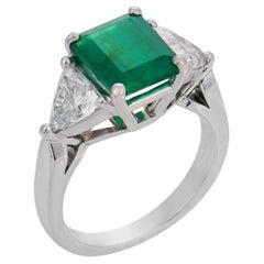 Vintage 1.84 carat emerald diamond platinum three stone ring