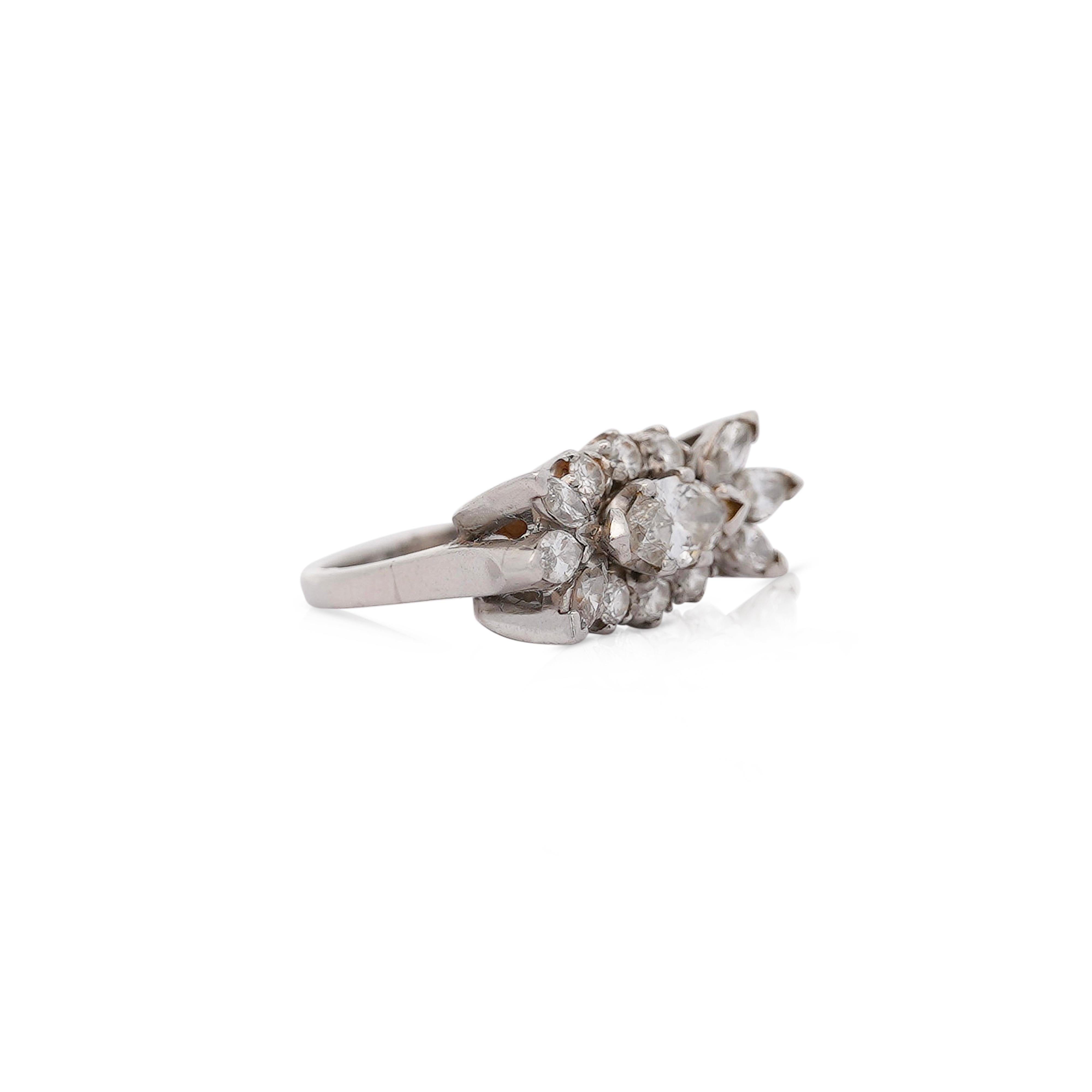 Vintage marquise cut natural diamond cluster east-west set cocktail ring in platinum 900. Set with a stunning handmade two prong setting fastening the diamonds. This ring has a charming assortment of diamonds with good whiteness and near eye-clean