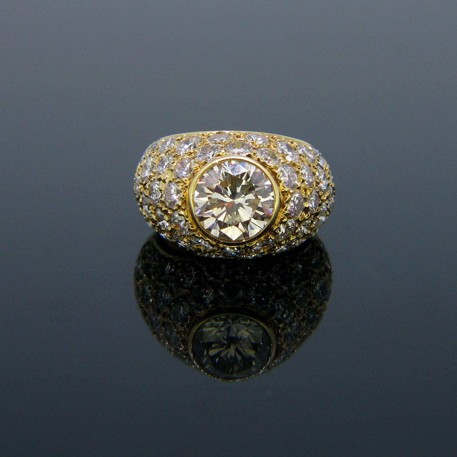 This beautiful diamond ring is set with a brilliant cut of 1.85ct approximately and paved with 56 diamonds. The total diamond carat weight on this ring is over 5ct. The band is made in 18kt yellow gold.

Weight:	10.71gr

Metal:		18kt Yellow