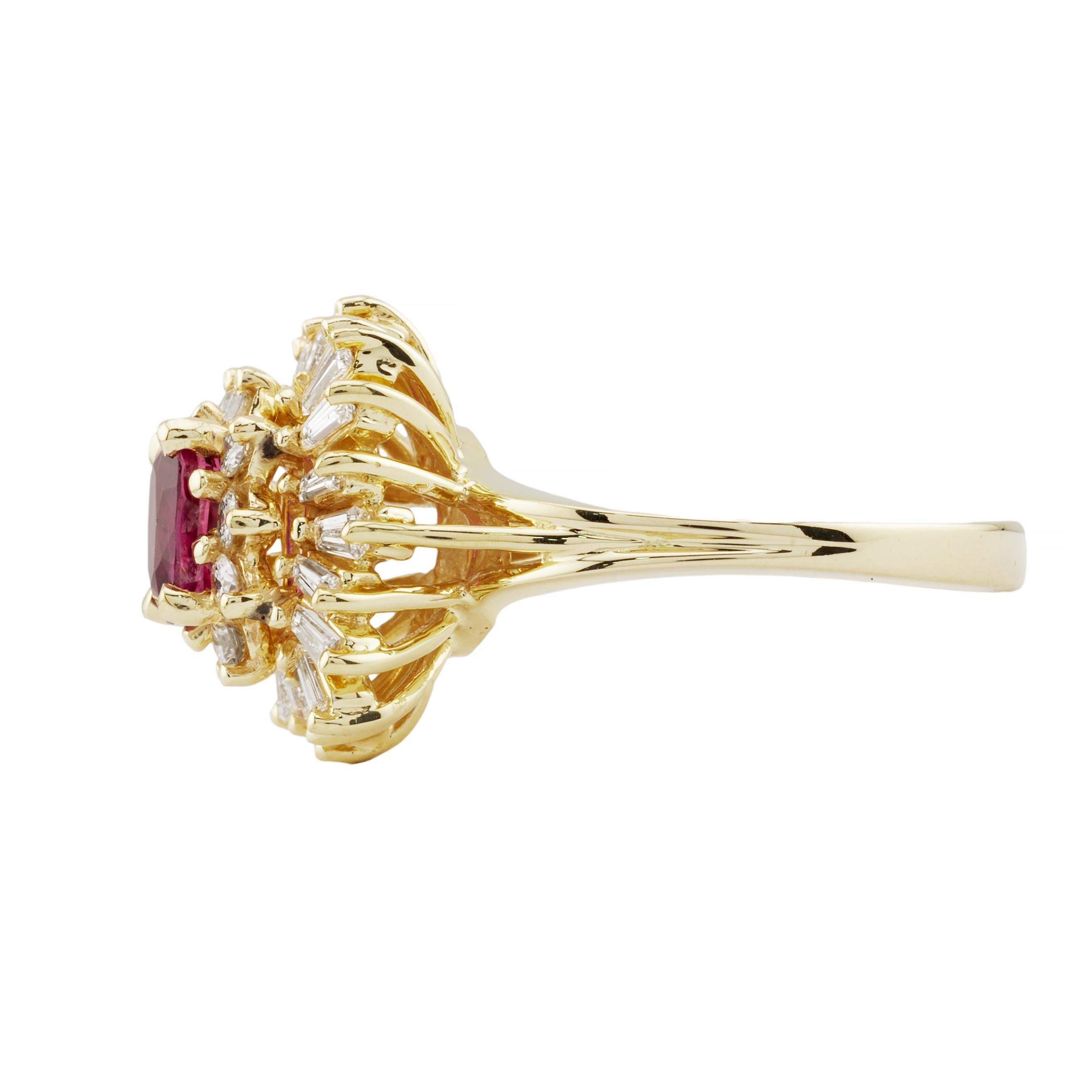 Aston Estate Jewelry Presents:

A vintage ruby and diamond ballerina style ring in 14 karat yellow gold.  Centered by a 0.86 carat vivid red ruby of beautiful quality.  Accented by 1.00 carats of baguette and brilliant cut diamonds of H color with