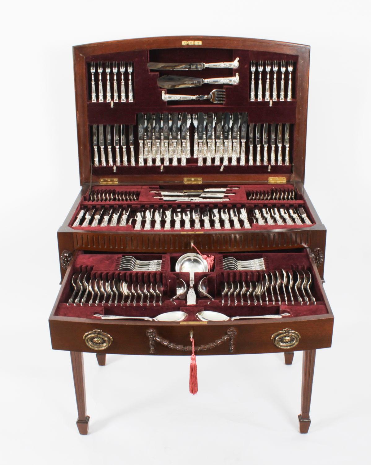 An elegant solid silver twelve place 187 piece canteen of flatware cutlery in the elegant Kings pattern, by Viners Ltd, Sheffield in a Westminster walnut fitted canteen on fluted tapering legs, circa 1964 in date.

The set is complete and
