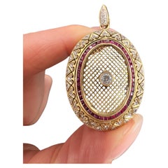 Colgante vintage de oro de 18 ct, con forma ovalada de rubí y diamante calibrado de los años 70