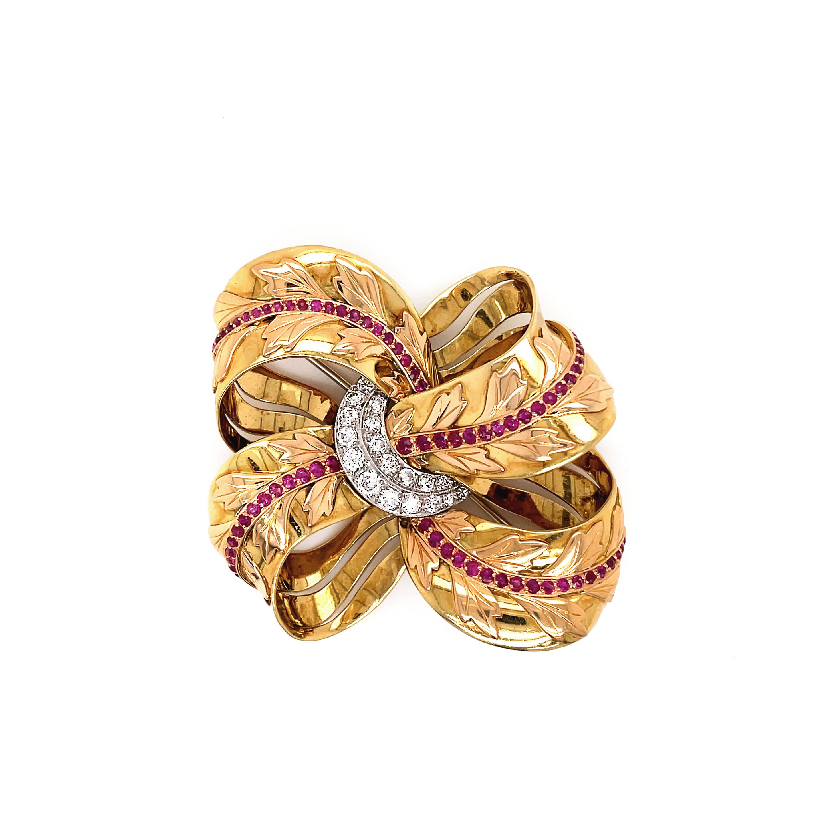 This original 1950's yellow gold vintage ribbon brooch is beautifully decorated with a rose gold contrasting leaf motif, centrally lined through each loop with 76 vibrant rubies totalling to an approximate weight of 1.30ct. Entwined in the centre is