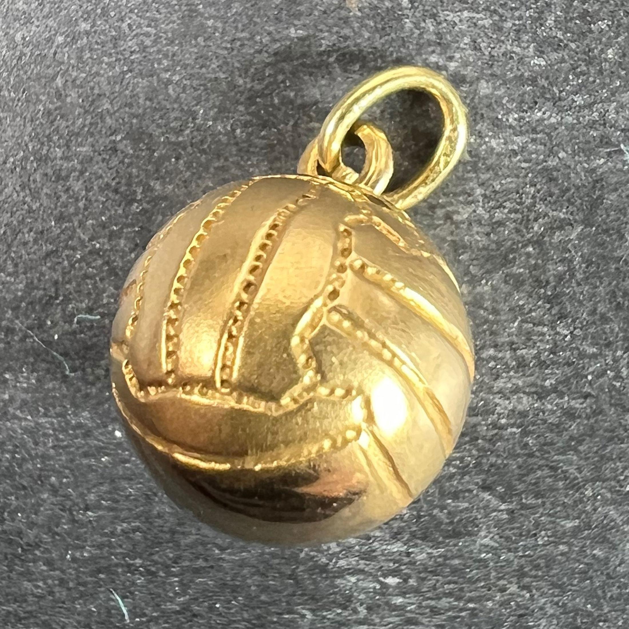 A vintage 18 karat (18K) yellow gold charm pendant designed as a football or soccer ball. Unmarked but tested for 18 karat gold.

Dimensions: 1.3 x 1 x 1cm (not including jump ring)
Weight: 1.18 grams.
(Chain not included) 