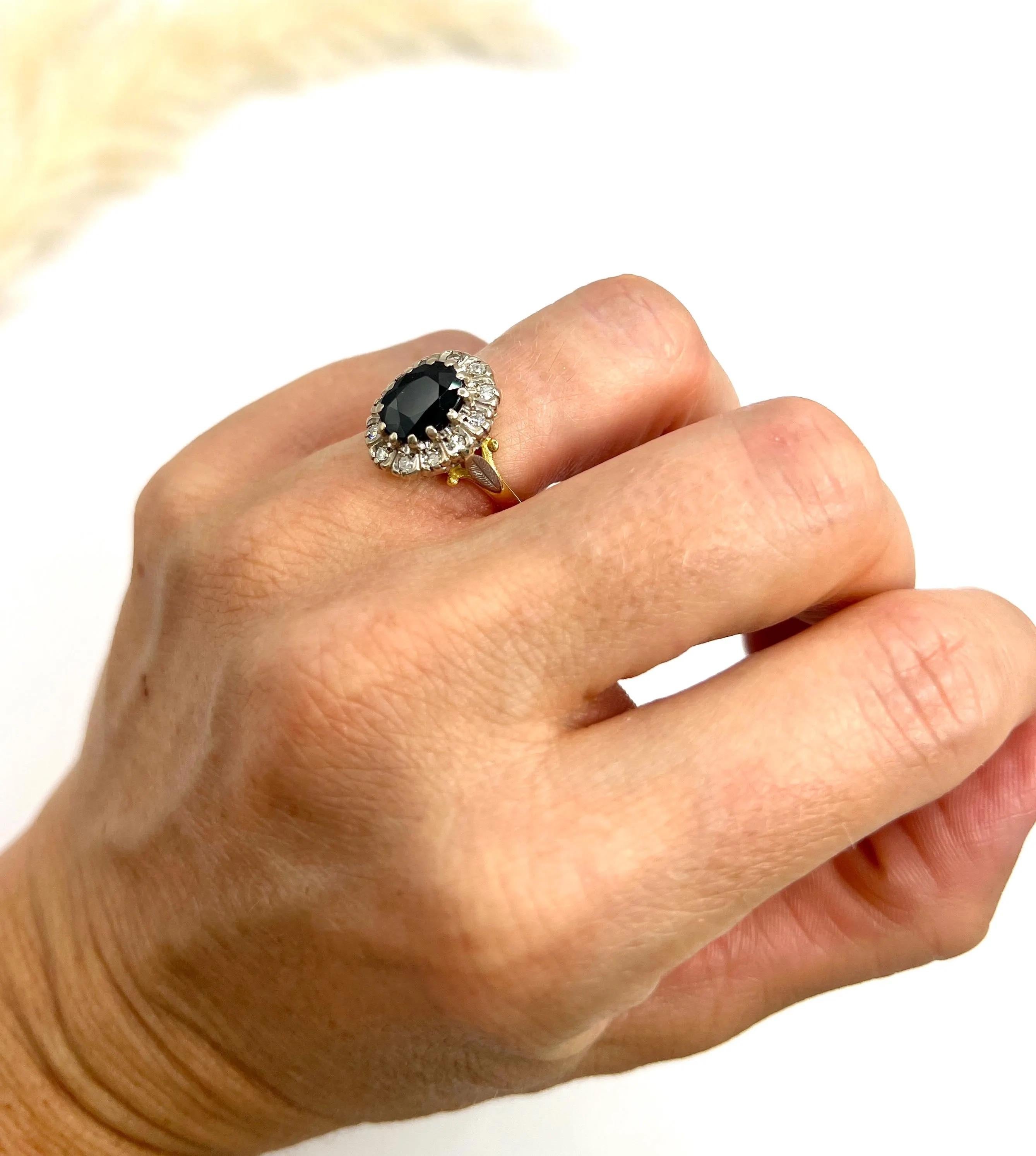 Vintage Cluster Ring

18ct Yellow Gold 

Hallmarked London 1977

Discover the elegance of this stunning 18ct gold vintage cluster ring, crafted in the enchanting 1970s. This beautiful piece features a captivating, oval-shaped, faceted natural