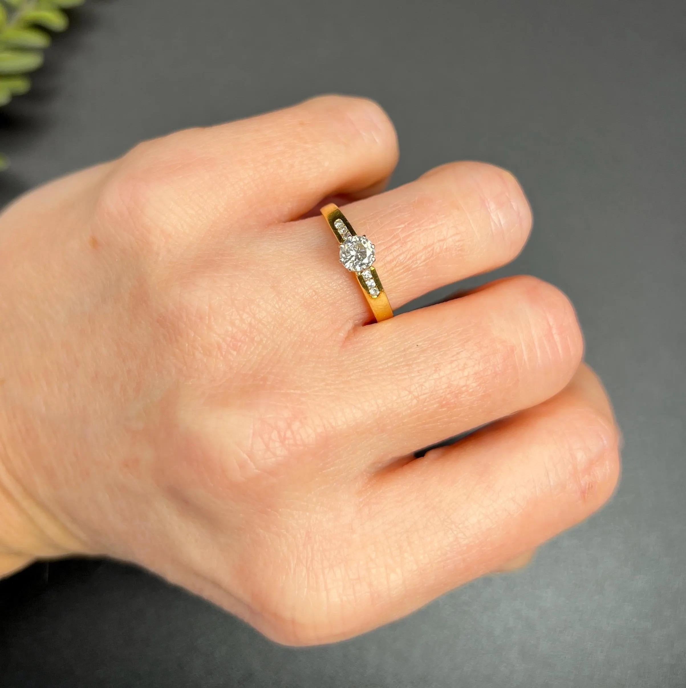 Antique Engagement Ring

18ct Yellow Gold 

Hallmarked London 1987

This beautiful engagement ring is truly one-of-a-kind. It features a stunning 0.35-carat natural diamond set in white gold, which enhances its sparkle and shine. The ring is mounted
