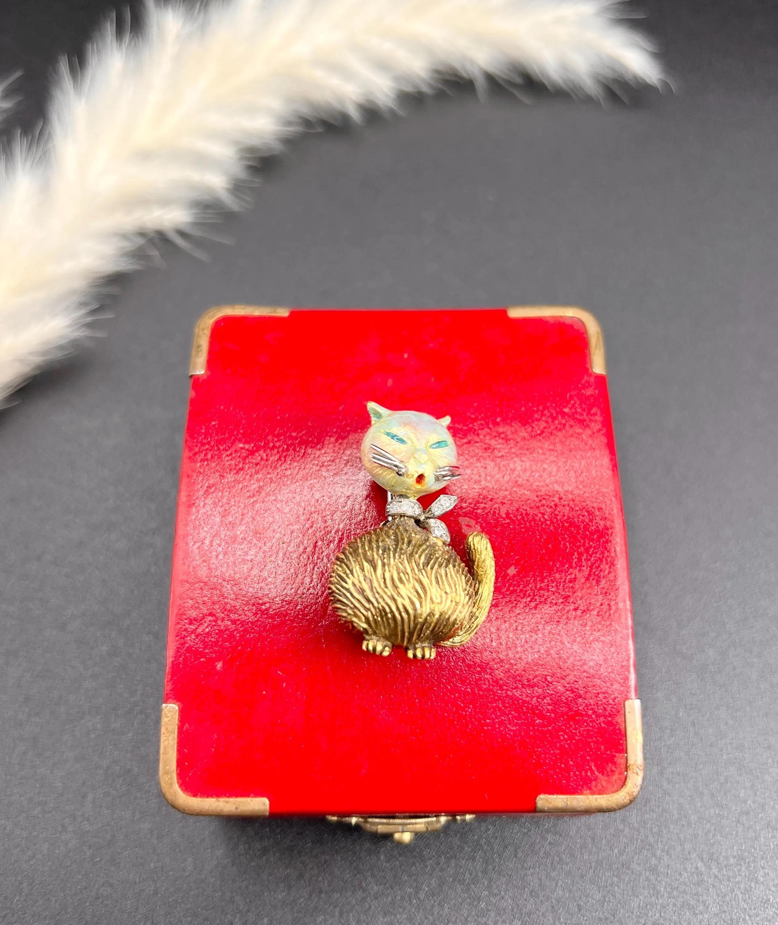 Vintage Cat Brooch

18ct Gold Stamped 

Circa 1960s

Embrace the charm and elegance of the past with this stunning Art Deco-style cat brooch, a true testament to the artistry of the 1960s. This piece radiates character with its intricately designed