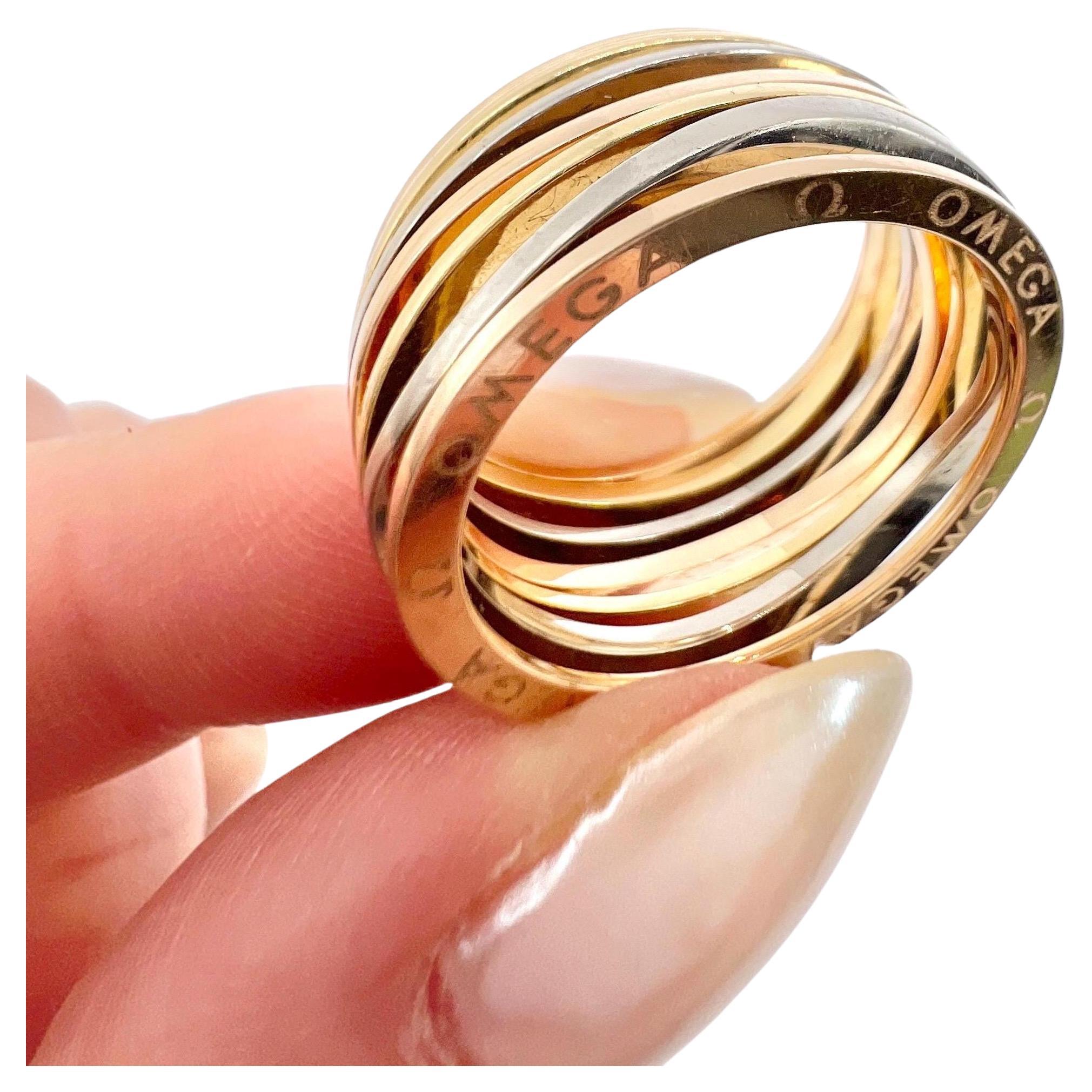 Anillo vintage de oro de 18 ct estampado, Omega Ladymatic de tres colores con banda ondulada de oro