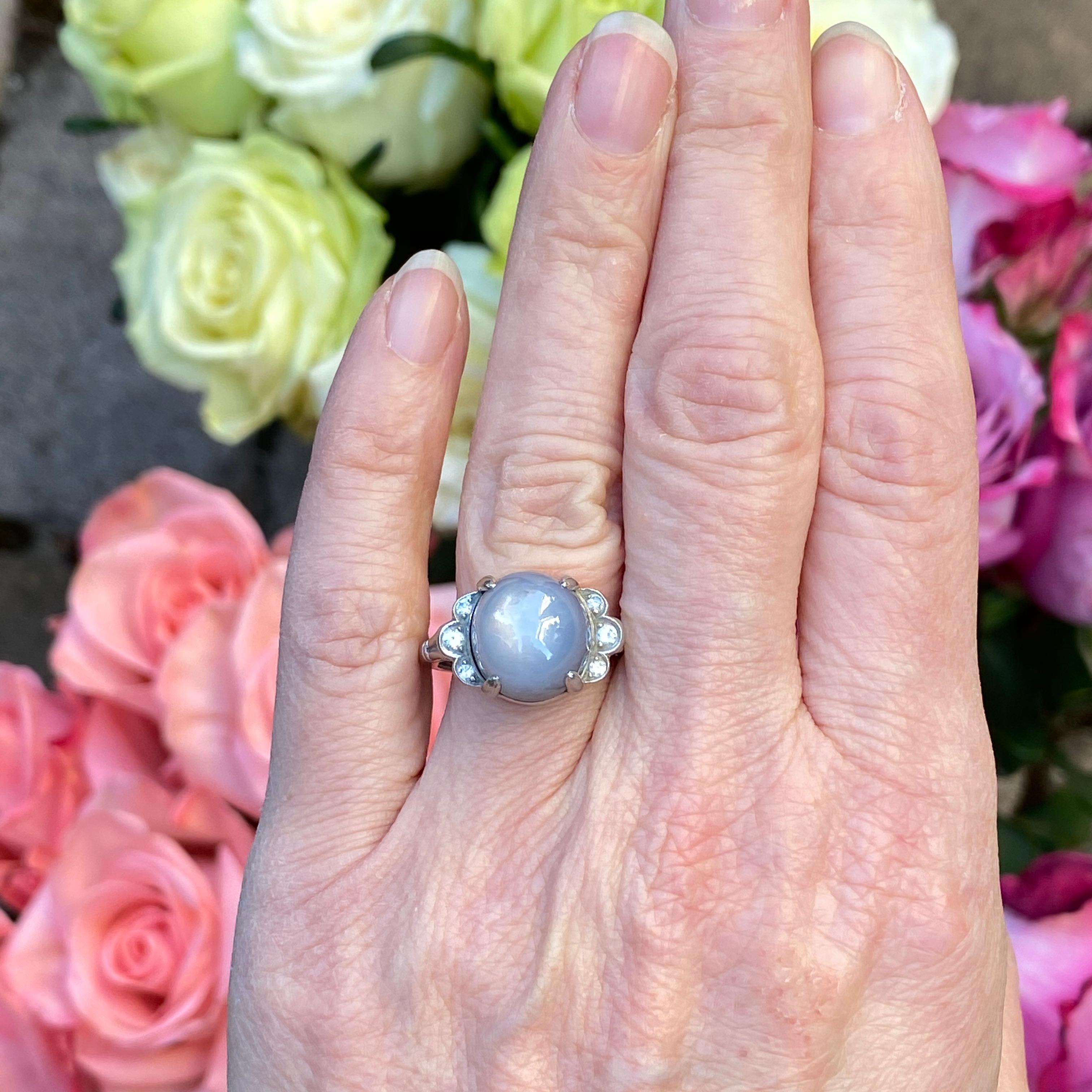 Details:
This fabulous ring is a show stopper! The star sapphire is a beautiful misty blue grey color with a fabulous glow. This ring is from Granat Bros, and is stamped on the inside of the band. This ring comes with an appraisal, and appraised for