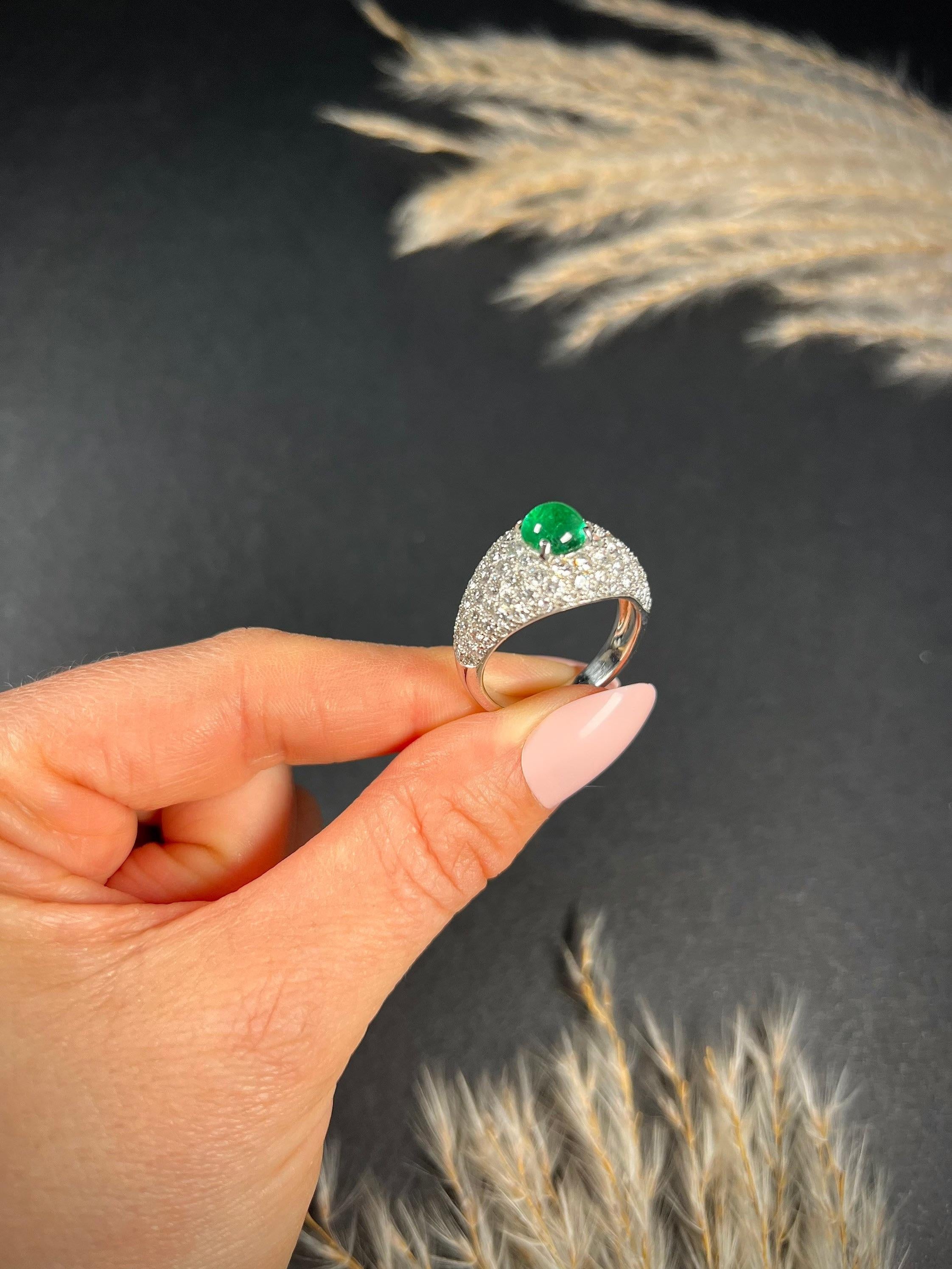 Vintage Emerald & Diamond Ring 

18ct White Gold- French Stamped 

Circa 1940’s

Fabulous, French bombe style ring. Set with a centre, cabochon, natural emerald & the most gorgeous, bright, white, natural diamonds. The stones are set in white gold &