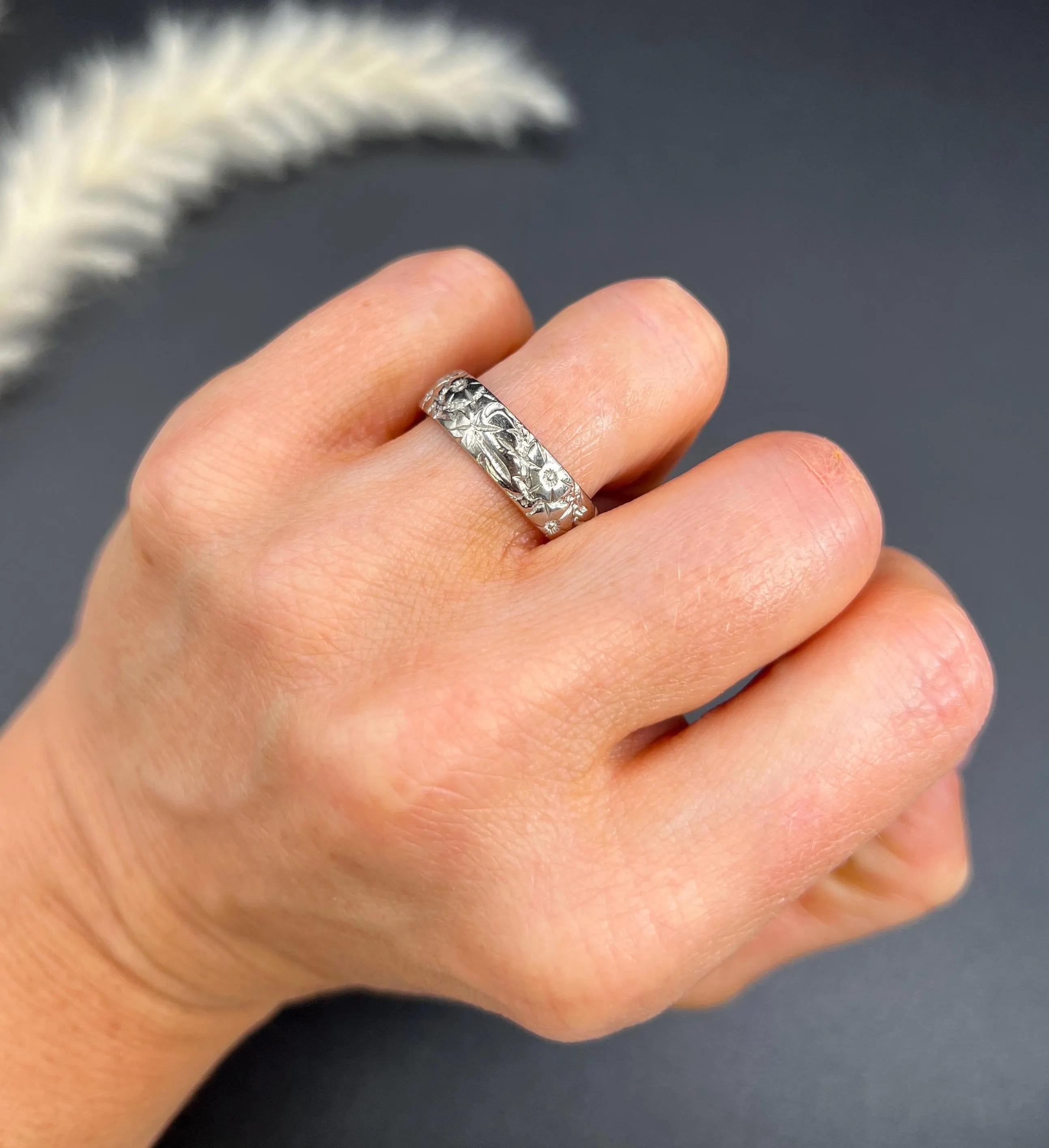 Vintage Wedding Band

18ct White Gold 

Hallmarked London 1965

Makers Mark W W Ld- W Wilkinson Ltd

This lovely 18ct white gold band is the epitome of vintage elegance. Decorated with intricate floral engraving all the way around, this band is sure