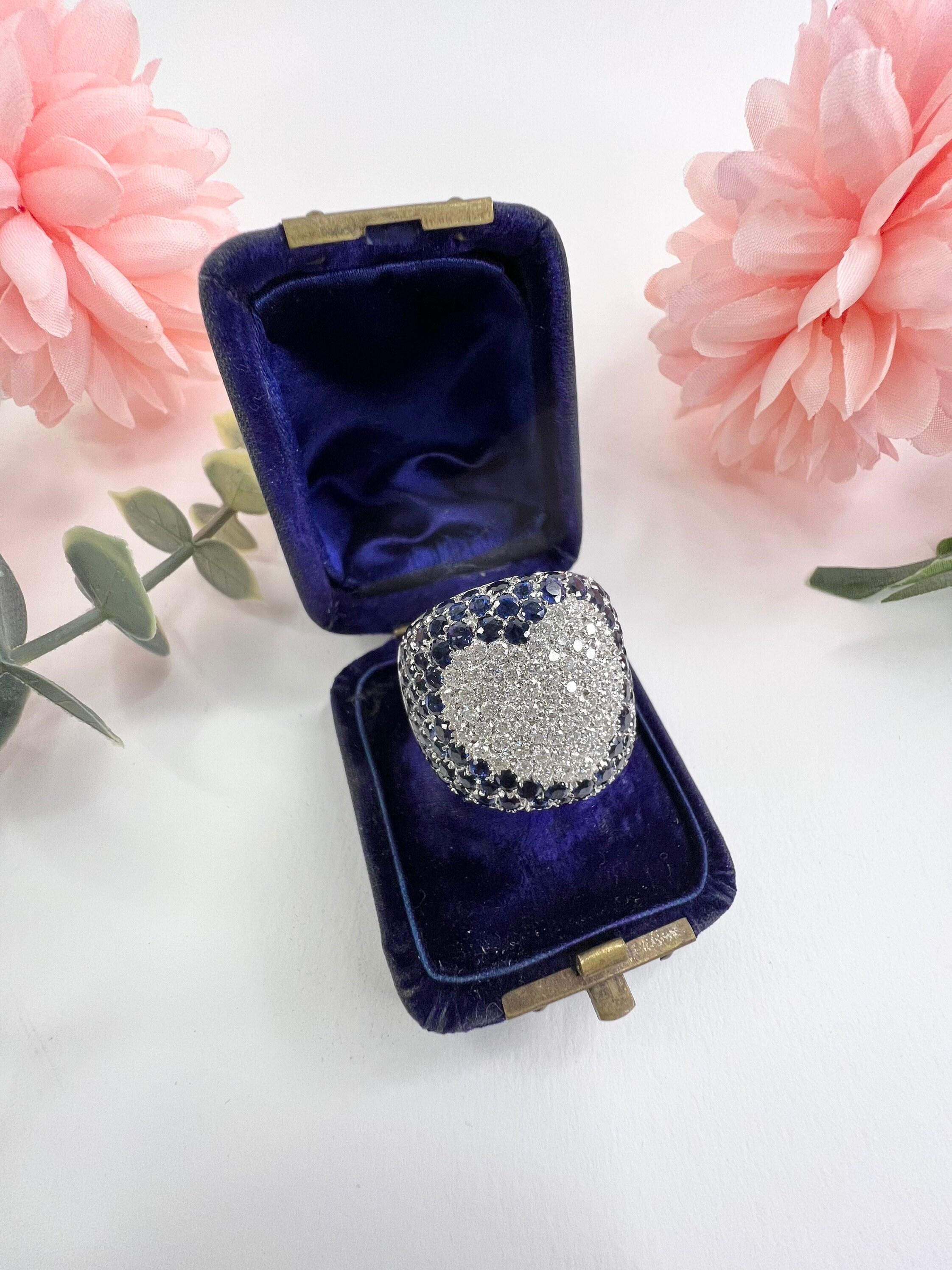 Sapphire & Diamond Heart Ring

18ct White Gold 

French Stamped 750 with Paris Owl 75 Hallmark

Circa 1980’s

Makers Mark P B 

Beautiful, Vintage White Gold Sapphire & Diamond Heart Ring By Italian Designer Pasquale Bruni.
This Fabulous Pavé Ring