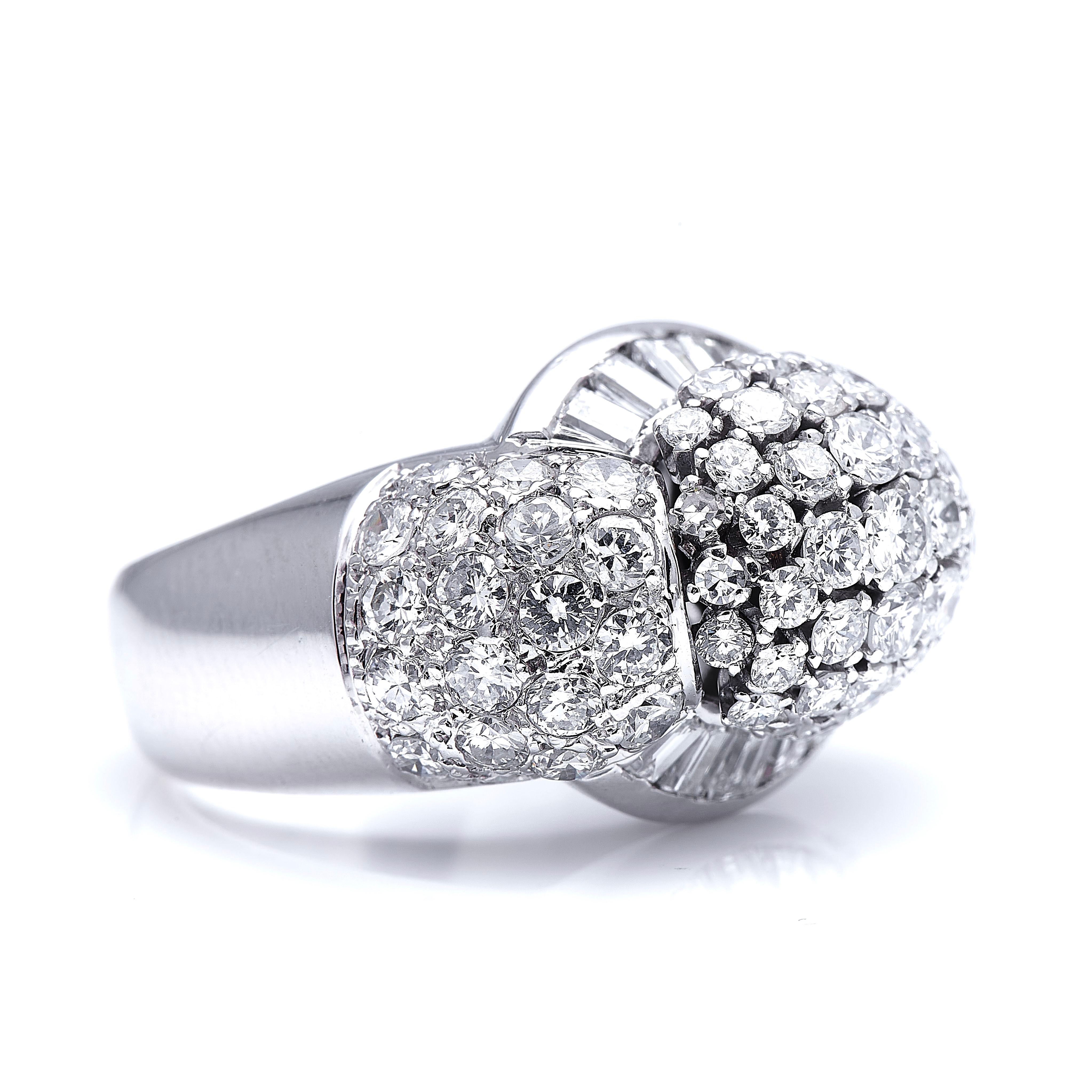 Vintage, large diamond bombe cocktail ring, circa 1950. Set with approximately 4 carats of bright white diamonds, this is a fantastic statement ring. The high dome centre and boasting shoulders are set with a pave of bright round-cut diamonds with